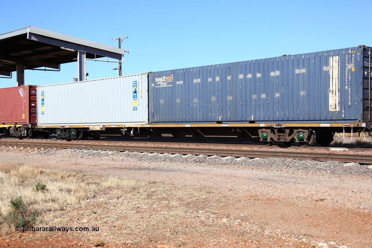 160522 2153
Parkeston, 6MP4 intermodal train, RQJW 60007 container waggon, one of fifty built by EPT NSW as NQJW type in 1984-85, with a pair of 40' containers, SCF sea2rail SCFU 408084 and Royal Wolf RWTU 441643.
Keywords: RQJW-type;RQJW60007;EPT-NSW;NQJW-type;