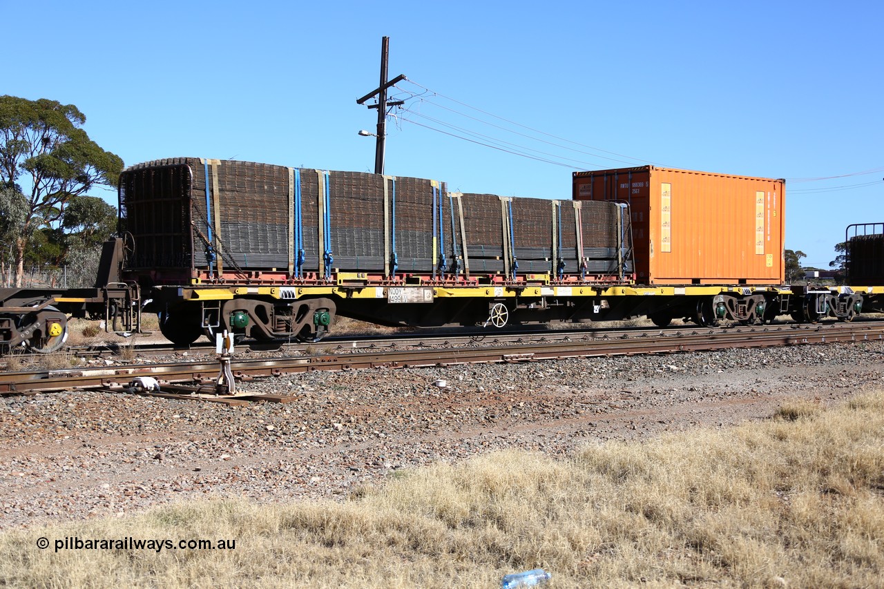 160522 2158
Parkeston, 6MP4 intermodal train, NQOY 14991 container waggon, one of fifty built by Tulloch Ltd NSW as type OCY in 1974-75 with an Allied Pickfords 20' 26G1 type box RWTU 966369[5] and a K+S Freighters 40' flatrack KT 4004#6 loaded with reo mesh.
Keywords: NQOY-type;NQOY14991;Tulloch-Ltd-NSW;OCY-type;