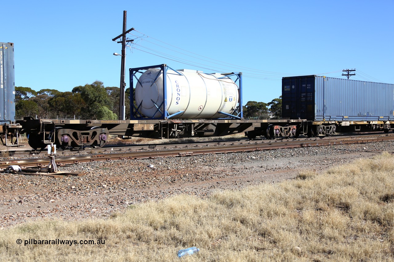 160522 2168
Parkeston, 6MP4 intermodal train, NQKY 34644 container waggon, originally built by EPT NSW as a CDY type open waggon in a batch of two hundred units in 1975-76, recoded to NOCY type, then converted to current form in 1997, loaded with a Cronos 20' 22T6 ISO tank CRXU 864685[0].
Keywords: NQKY-type;NQKY34644;EPT-NSW;CDY-type;NOCY-type;