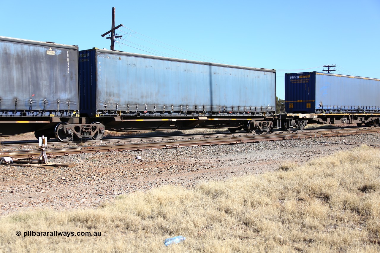 160522 2175
Parkeston, 6MP4 intermodal train, RQQY 7076 platform 1 of 5-pack articulated skel waggon set, 1 of 17 built by Qld Rail at Ipswich Workshops in 1995, 48' curtainsider PNXC 4470.
Keywords: RQQY-type;RQQY7076;Qld-Rail-Ipswich-WS;