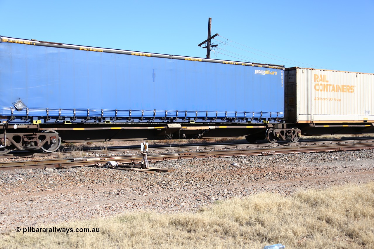 160522 2179
Parkeston, 6MP4 intermodal train, RQQY 7076 platform 5 of 5-pack articulated skel waggon set, 1 of 17 built by Qld Rail at Ipswich Workshops in 1995, 48' Pacific National curtainsider PNXC 5624.
Keywords: RQQY-type;RQQY7076;Qld-Rail-Ipswich-WS;