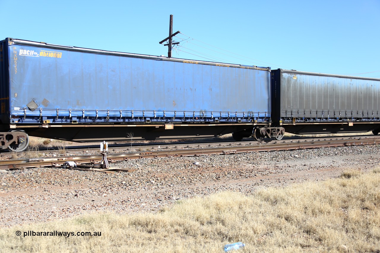 160522 2187
Parkeston, 6MP4 intermodal train, platform 3 of 5-pack RRGY 7130 5 pack articulated skel waggon set, originally built as RRBY by AN Rail at Islington Workshops SA 1996-97, 48' deck Pacific National curtainsider PNXM 5237.
Keywords: RRGY-type;RRGY7130;AN-Islington-WS;RRBY-type;