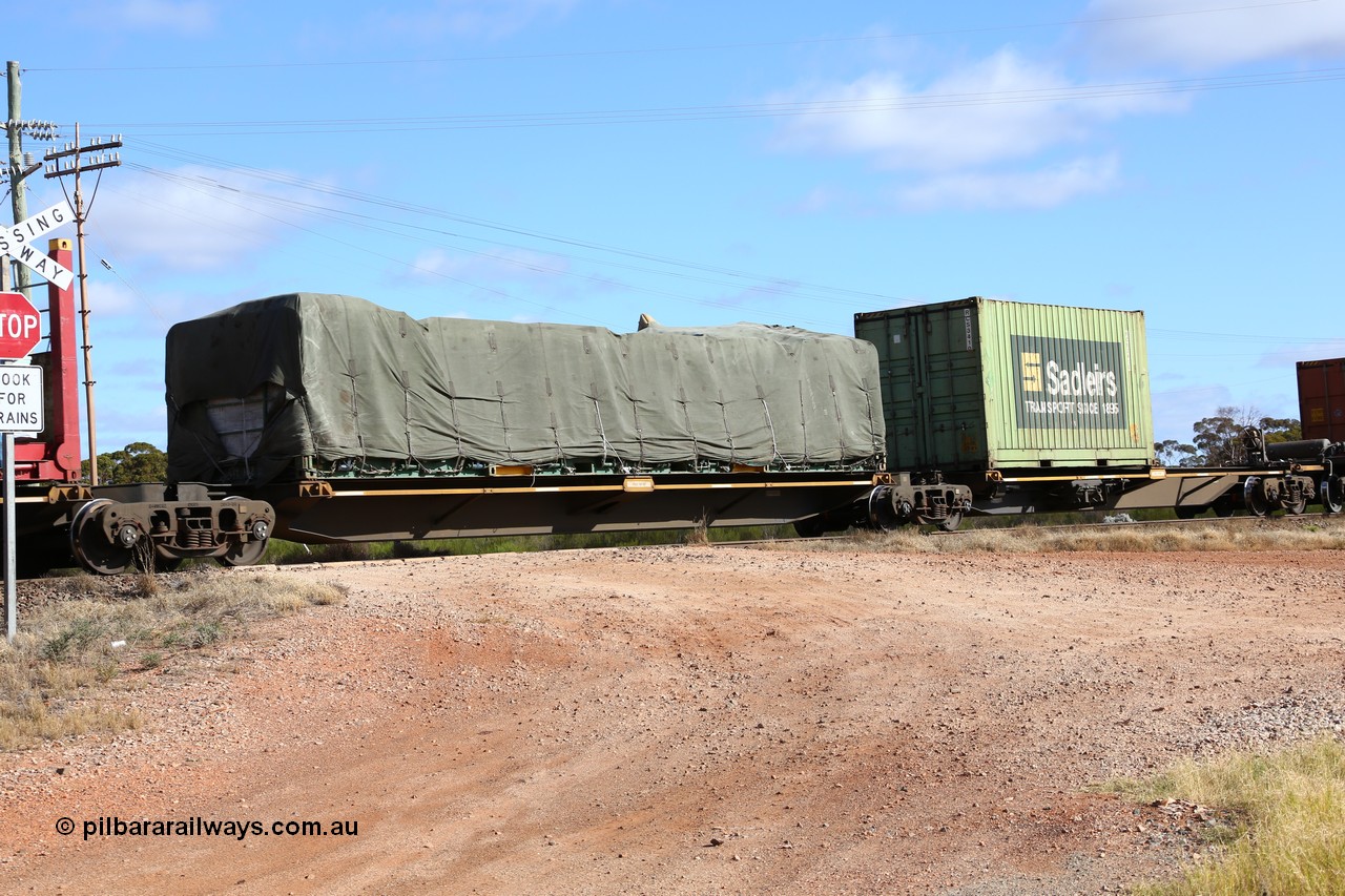 160522 2344
Parkeston, 7MP7 priority service train, platform 2 of 5-pack articulated skel waggon set, Qiqihar Rollingstock Works China built RRQY 5816, 40' KTI 102 flatrack with tarped load.
Keywords: RRQY-type;RRQY8516;Qiqihar-Rollingstock-Works-China;