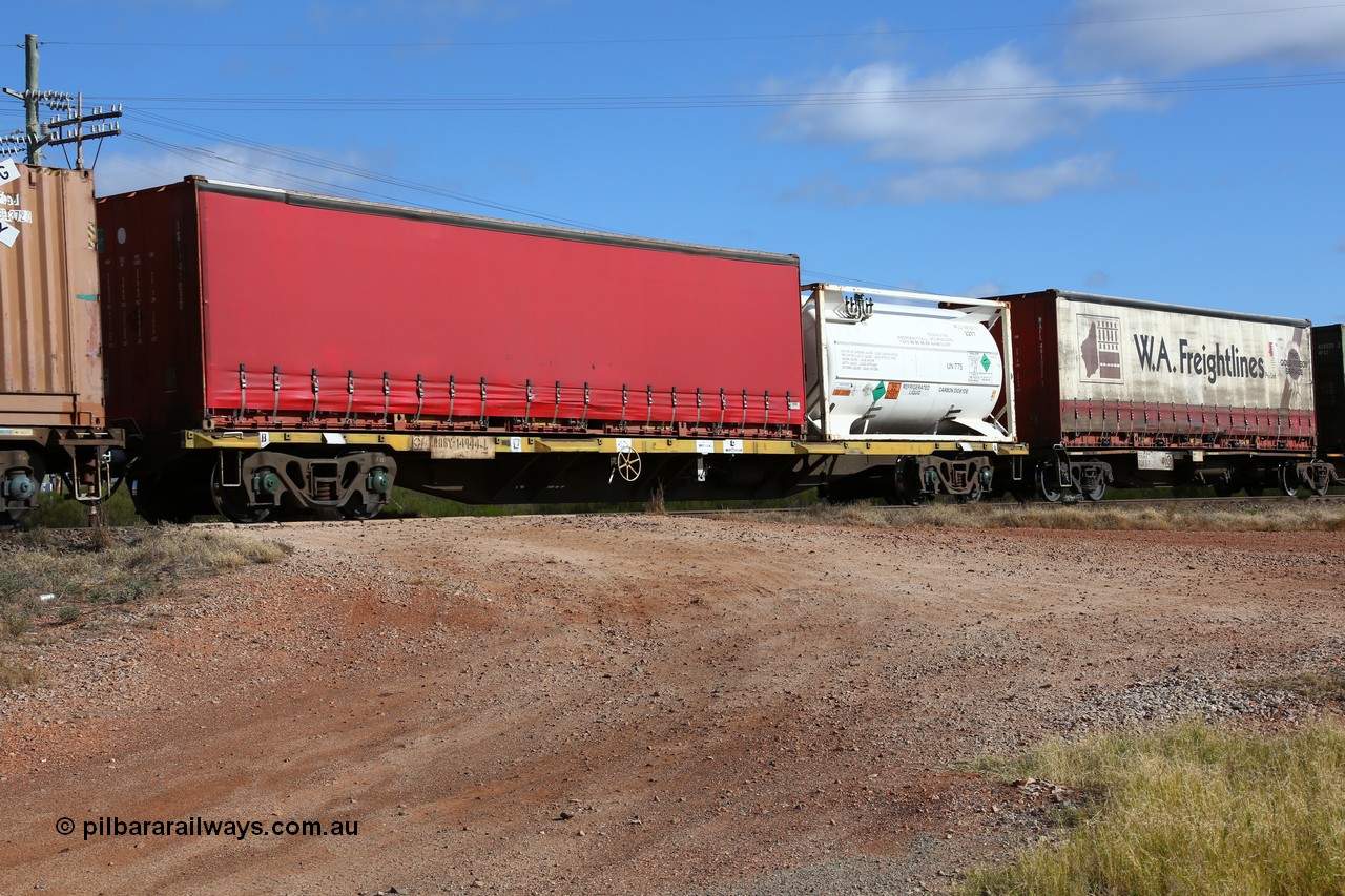 160522 2359
Parkeston, 7MP7 priority service train, RQGY 14944 container waggon, one of fifty built by Comeng NSW in 1974-75 as an OCY container flat, recoded to NQOY. Loaded with a 20' Air Liquide 22T7 ISO tank AFLU 100128[5] and 40' red curtainsider IS#U 41030.
Keywords: RQGY-type;RQGY14944;Comeng-NSW;OCY-type;NQOY-type;