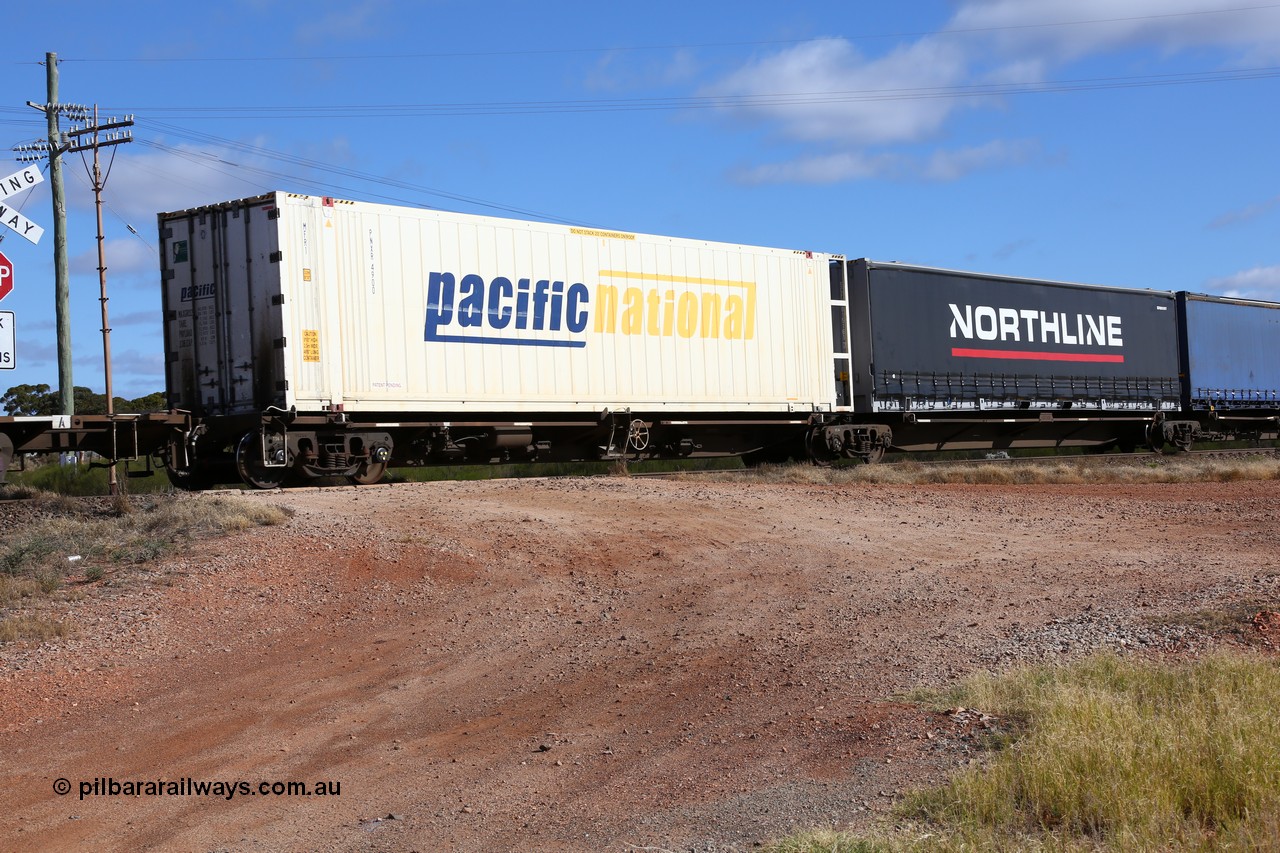 160522 2400
Parkeston, 7MP7 priority service train, platform 5 of 5 on RRQY 8344 5-pack articulated skeletal waggon set the last of a batch of 41 built by Qiqihar Rollingstock Works China in 2005 for Pacific National, with a 46' 6