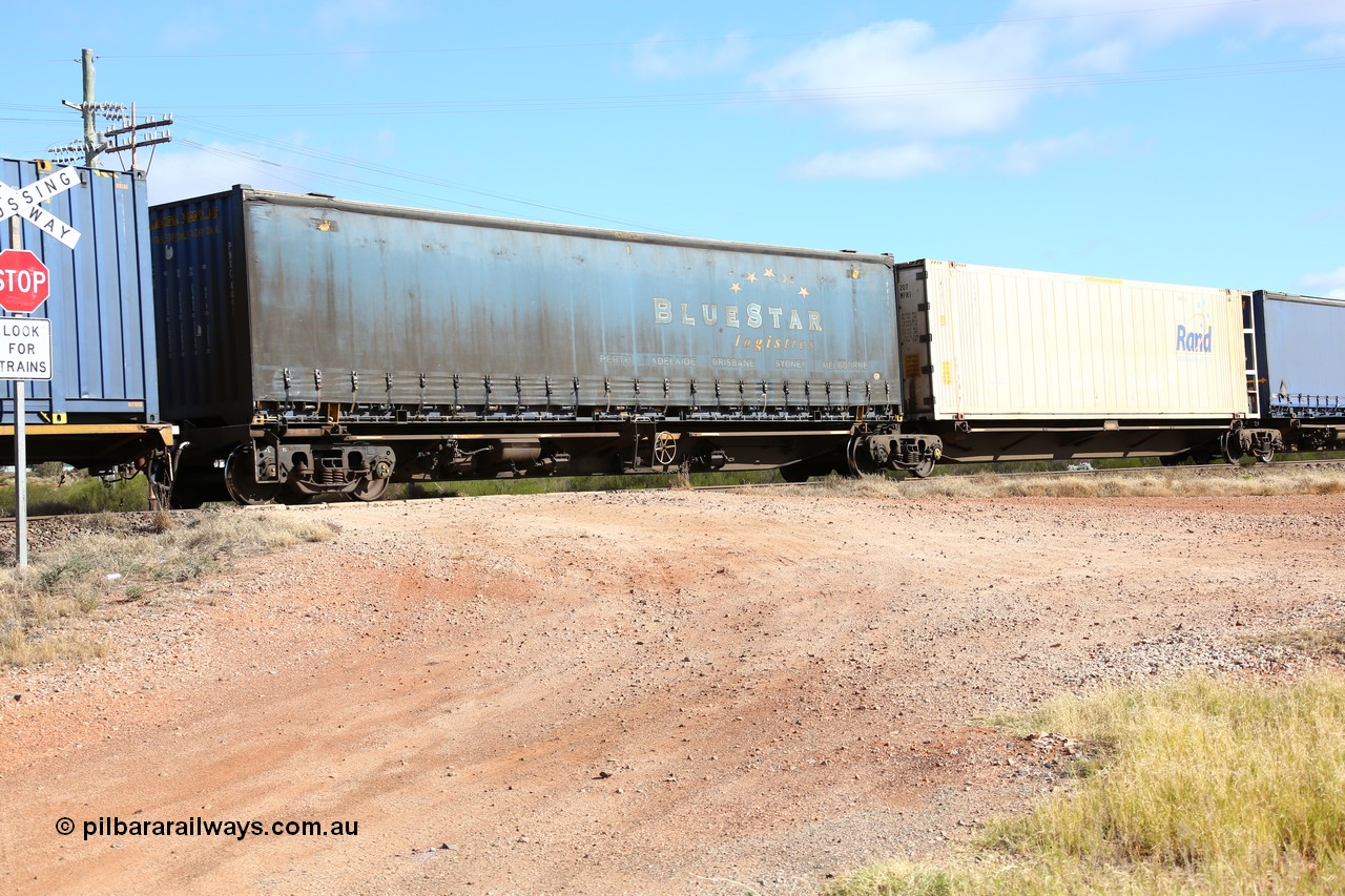160522 2412
Parkeston, 7MP7 priority service train, platform 5 of 5 on RRQY 7327 5-pack articulated skeletal waggon set built by Qiqihar Rollingstock Works China in 2005 for Pacific National, with a 48' Blue Star Logistics curtainsider PNXC 4491.
Keywords: RRQY-type;RRQY7327;Qiqihar-Rollingstock-Works-China;