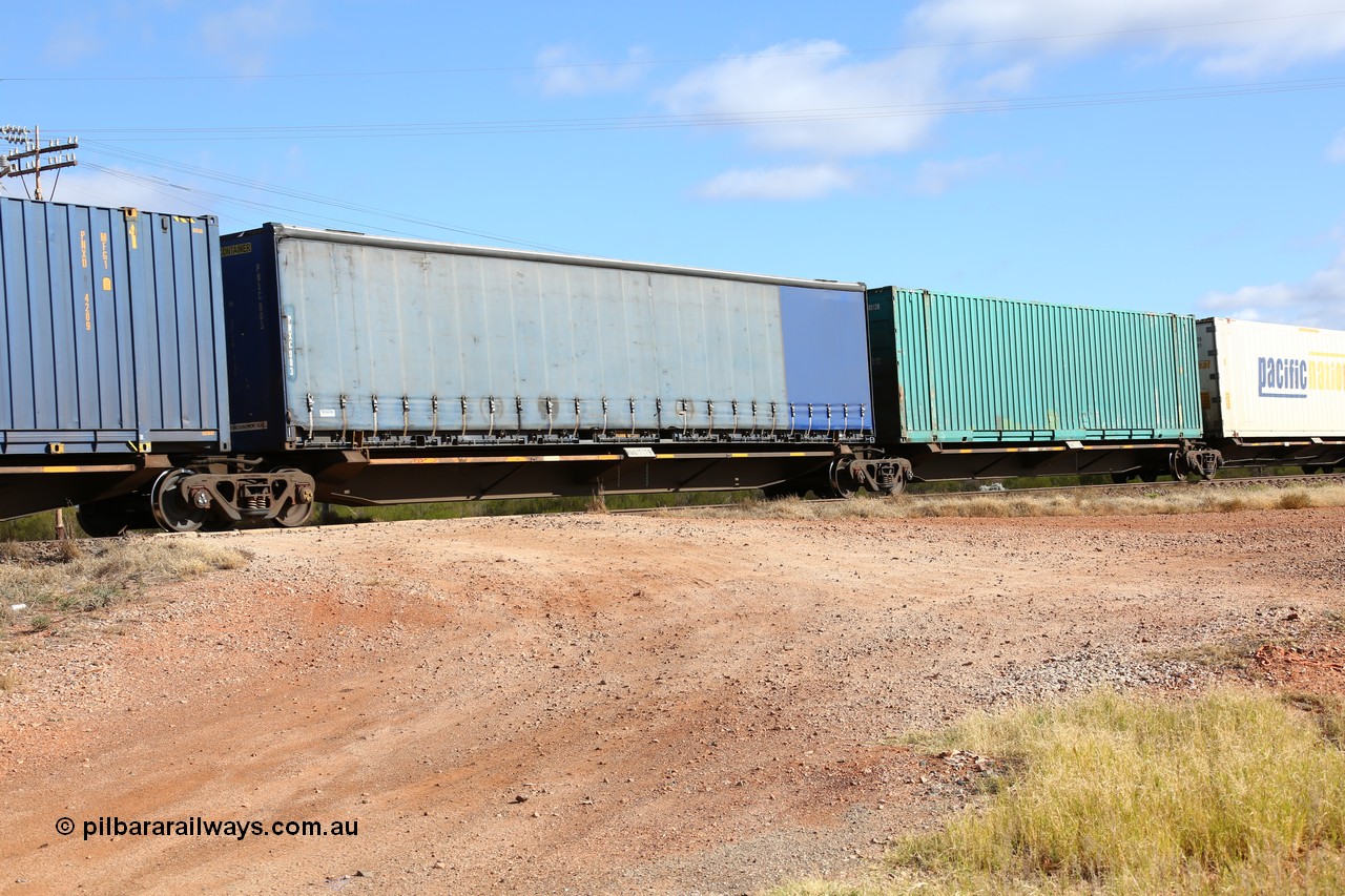 160522 2422
Parkeston, 7MP7 priority service train, RQQY 7079 platform 3 of 5-pack articulated skel waggon set, 1 of 17 built by Qld Rail at Ipswich Workshops in 1995, unmarked Pacific National 48' curtainsider PNXC 003.
Keywords: RQQY-type;RQQY7079;Qld-Rail-Ipswich-WS;
