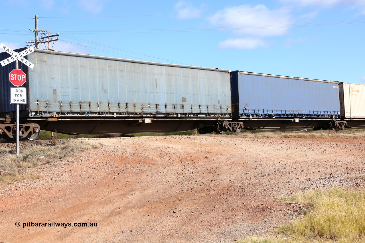 160522 2443
Parkeston, 7MP7 priority service train, RRAY 7249 platform 4 of 5-pack articulated skel waggon set, 1 of 100 built by ABB Engineering NSW 1996-2000, 48' deck with Pacific National curtainsider PNXM 4522 without logo.
Keywords: RRAY-type;RRAY7249;ABB-Engineering-NSW;