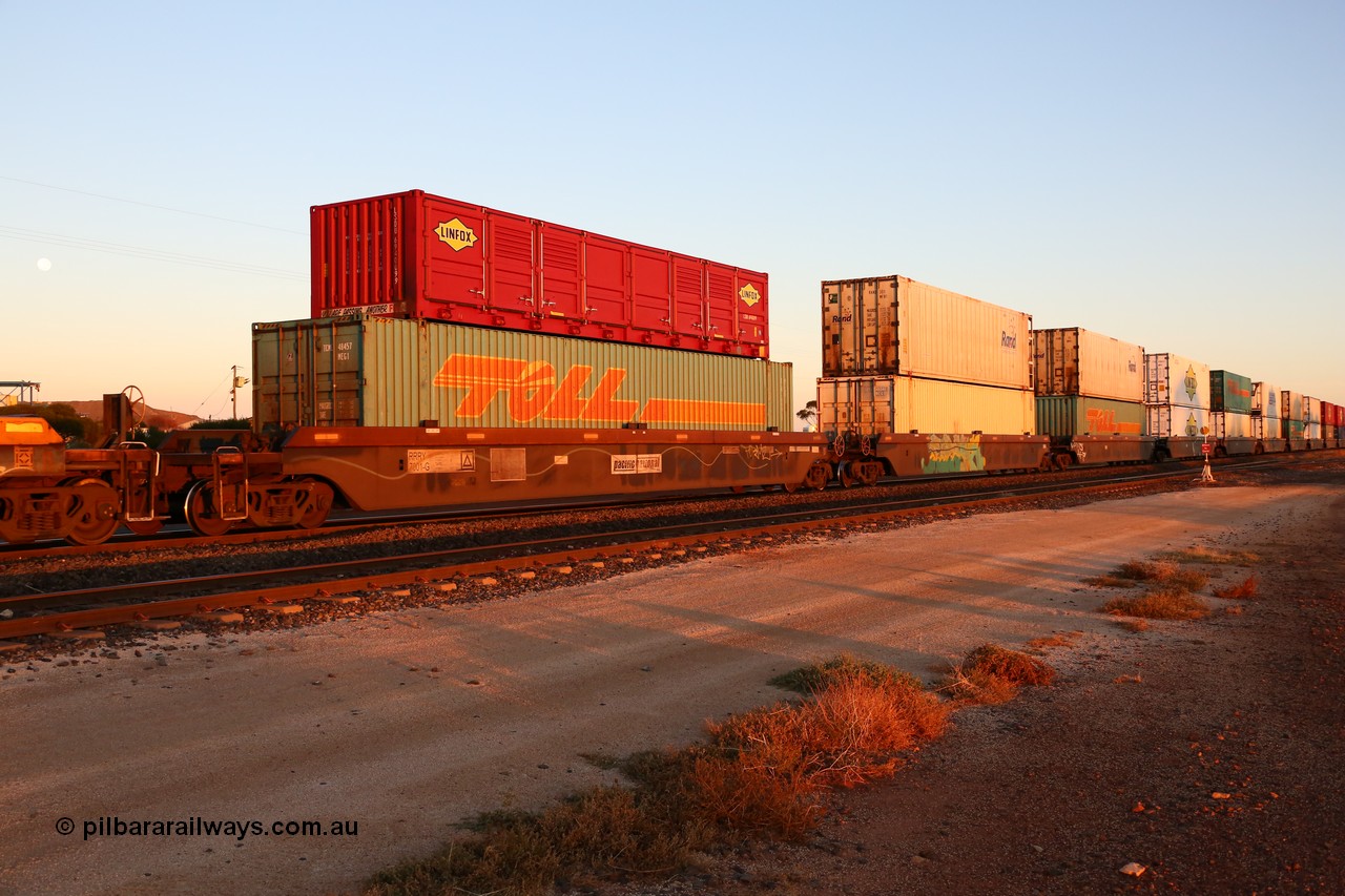 160523 2729
Parkeston, 1PM5 intermodal train, RRRY 7001 type leader of nineteen 5-pack well waggon sets built in China at Zhuzhou Rolling Stock Works for Goninan in 2005 with a variety of containers double stacked.
Keywords: RRRY-type;RRRY7001;CSR-Zhuzhou-Rolling-Stock-Works-China;