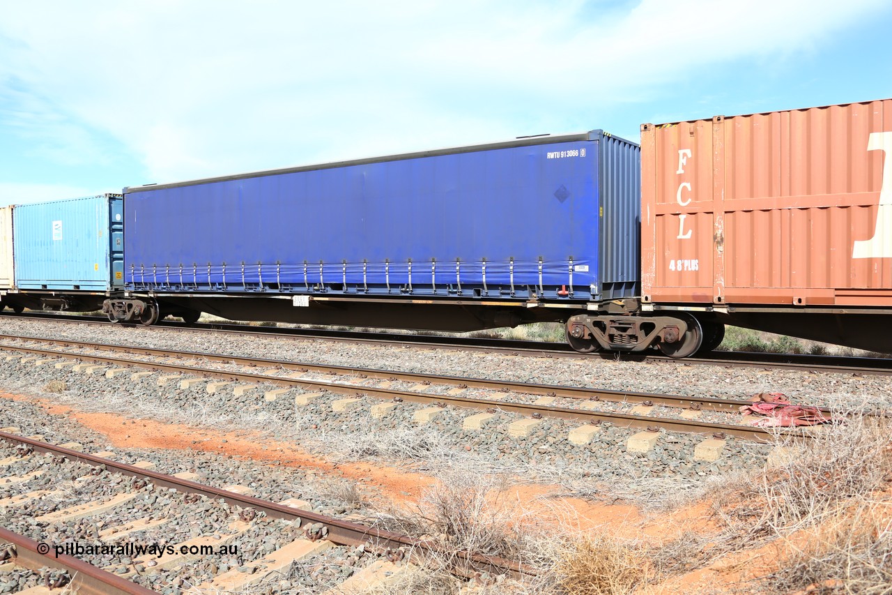 160523 2940
Parkeston, 7SP3 intermodal train, RRGY 7128 platform 2 of 5-pack articulated skel waggon, one of fifty originally built by AN Rail Islington Workshops in 1996-97 as type RRBY, later rebuilt with 48' intermediate decks and coded RRGY, with a Royal Wolf 48' curtainsider RWTU 913066.
Keywords: RRGY-type;RRGY7128;AN-Islington-WS;RRBY-type;