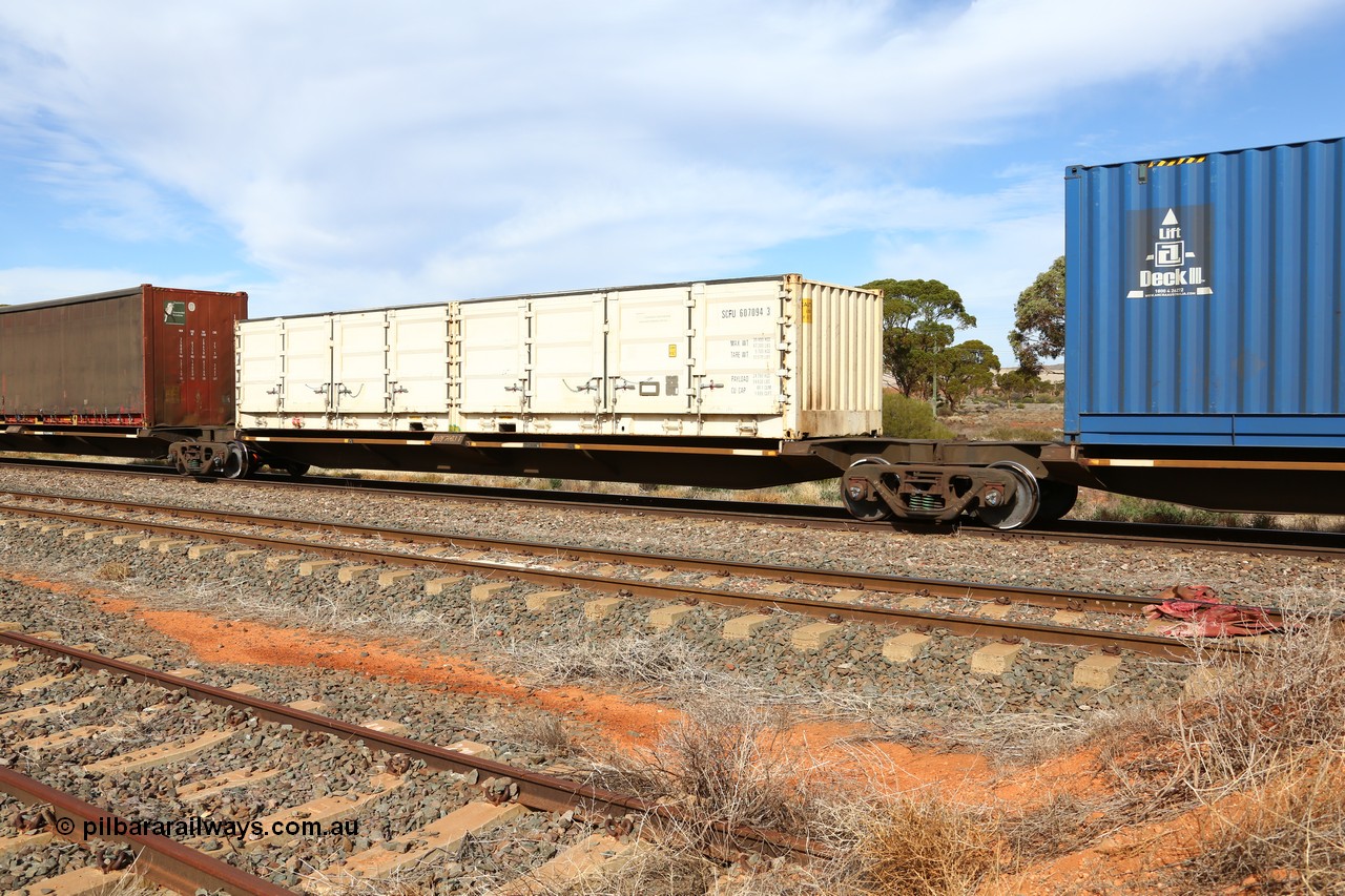 160523 2945
Parkeston, 7SP3 intermodal train, RQQY 7003 platform 3 of 5-pack articulated skel waggon built as a 'one off' by AN Rail Islington Workshops in 1994 as REQY with electric power connections, SCF Containers SCFU 607094 half height side door 40' container.
Keywords: RQQY-type;RQQY7003;AN-Islington-WS;REQY-type;