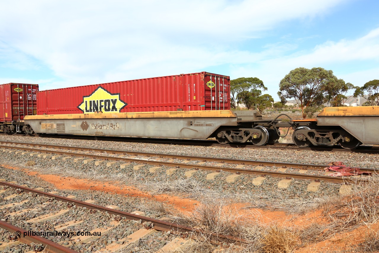 160523 2965
Parkeston, 7SP3 intermodal train, RQZY 7053 platform 1 of five unit bar coupled well container waggon set built in a batch of thirty two by Goninan NSW in 1995/96, loaded with Linfox 48' container FGDU 910816.
Keywords: RQZY-type;RQZY7053;Goninan-NSW;