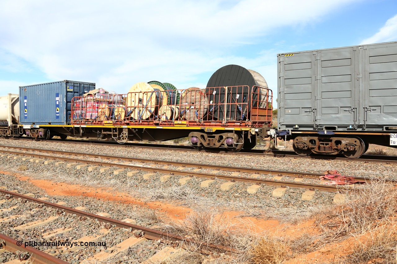 160523 2974
Parkeston, 7SP3 intermodal train, RQFY 47 container waggon, built by Victorian Railways Newport Workshops in 1978 in a batch of twenty as QMX type skeletal container waggons, recoded to VQFX, RQFX, RQFF, August 1995 2CM bogies fitted and to RQFY. A 40' Simon FD flatrack FD 146 loaded with cable drums and Royal Wolf 20' box RWLU 096014.
Keywords: RQFY-type;RQFY47;Victorian-Railways-Newport-WS;QMX-type;VQFX-type;RQFX-type;RQFF-type;