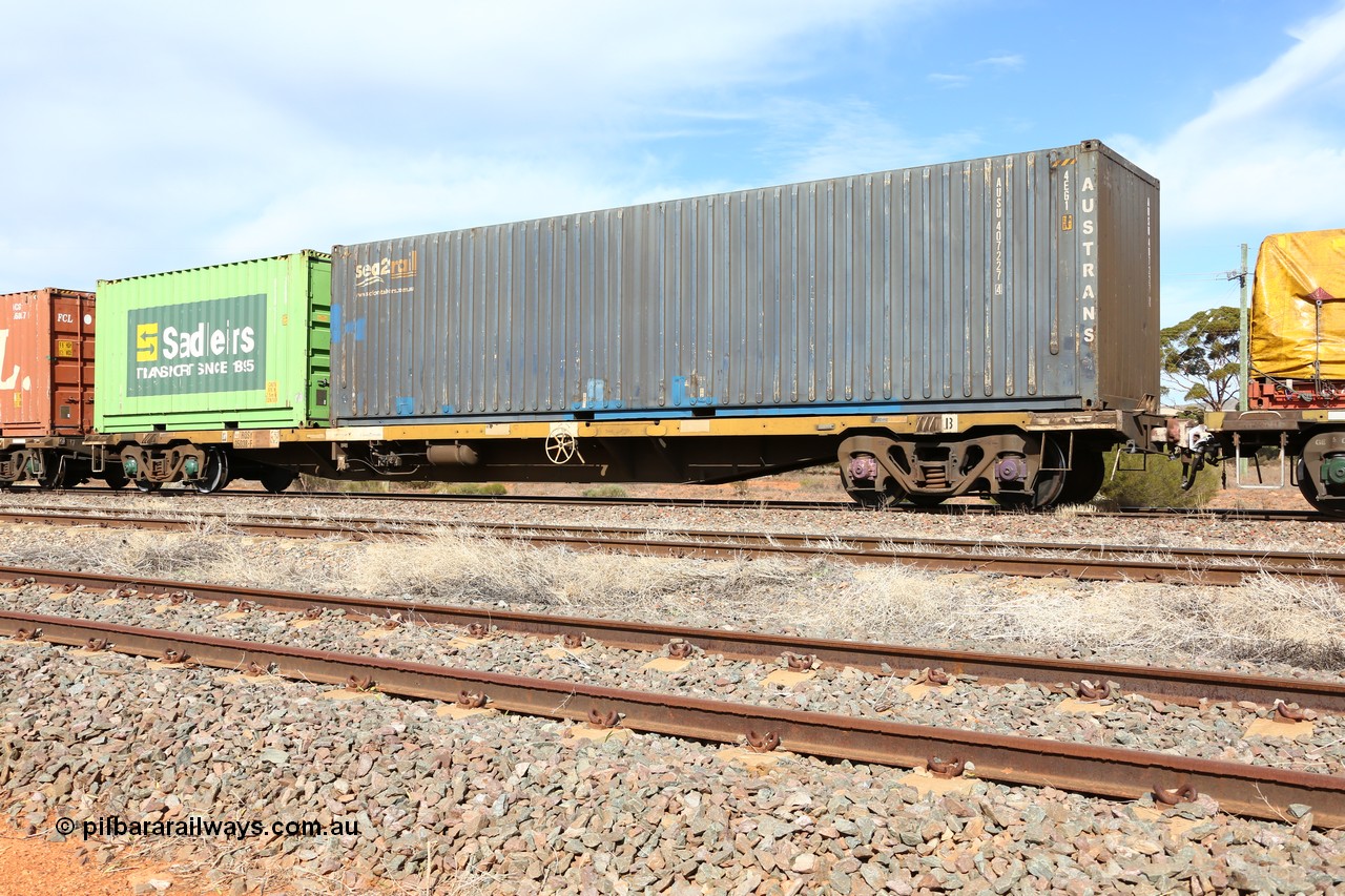 160523 2997
Parkeston, 7SP3 intermodal train, RQSY 35038 63' container waggon, one of a hundred OCY type waggons built by Goninan NSW in 1975, recoded to NQOY, then NQSY. Loaded with an Austrans leased sea2rail 40' 4EG1 type box AUSU 407227[4] and a Sadleirs 20' 2EB0 type box RCSB 5111.
Keywords: RQSY-type;RQSY35038;Goninan-NSW;OCY-type;NQOY-type;NQSY-type;