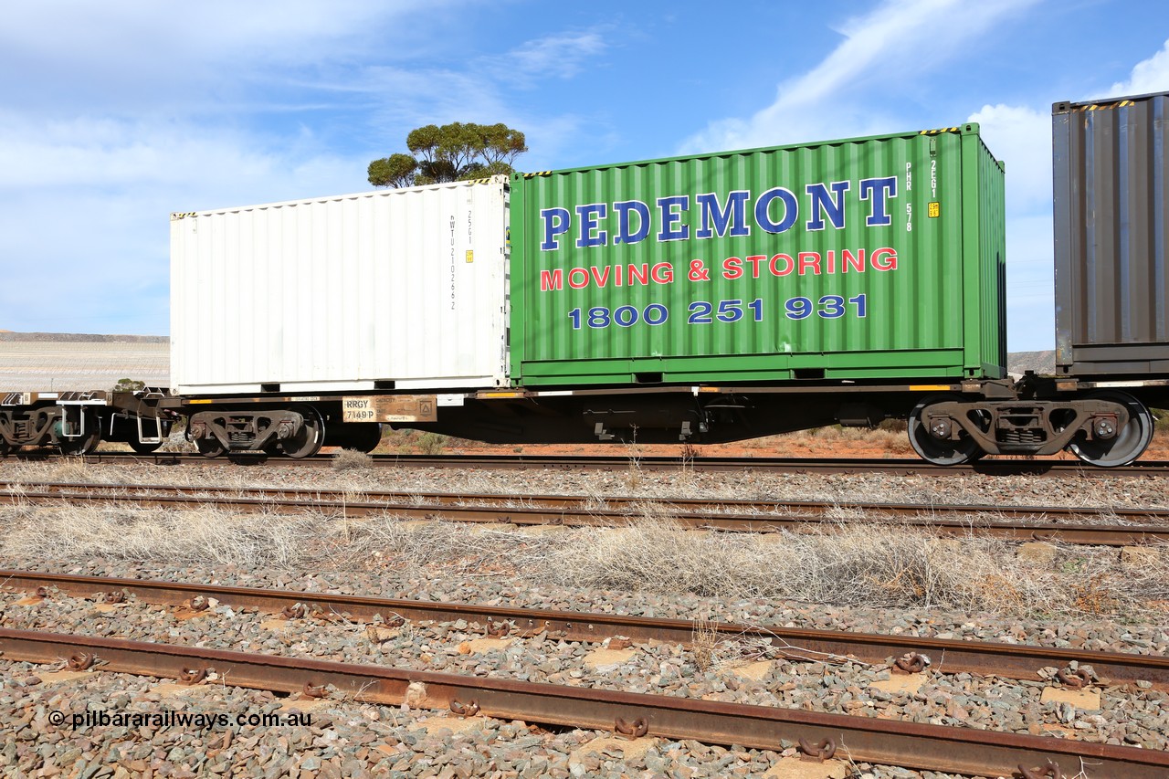 160523 3002
Parkeston, 7SP3 intermodal train, RRGY 7149 platform 1, the RRGY type is a 5-pack articulated skeletal container waggon, fifty were originally built by AN Rail Islington Workshops in 1996-97 as type RRBY, later rebuilt with 48' intermediate decks and recoded to RRGY. Loaded with a Pedemont 20' 2EG1 type box PHR 578 and a Royal Wolf 20' 25G1 type box RWTU 210266[2].
Keywords: RRGY-type;RRGY7149;AN-Islington-WS;RRBY-type;