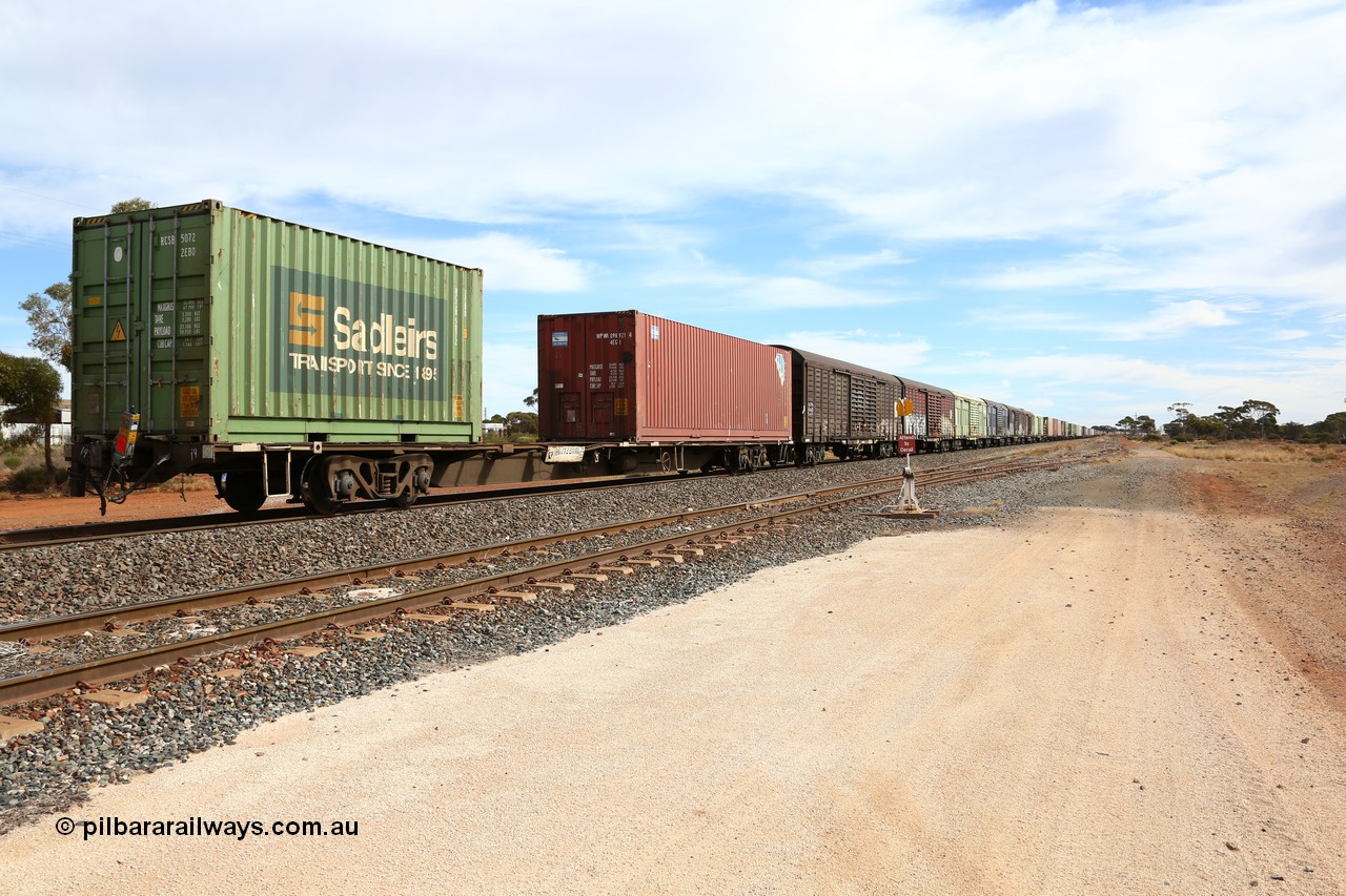 160523 3045
Parkeston, 7SP3 intermodal train, view looking from the rear with RQJW 22081 container waggon, one of fifty built in 1975-76 by Mittagong Engineering NSW as JCW type, recoded to NQJW loaded with a CPC 40' 4EG1 type box WPWU 098921 and Sadleirs 20' 2EB0 type box RCSB 5072 and then the RLUY and RSLY louvre vans.
Keywords: RQJW-type;RQJW22081;Mittagong-Engineering-NSW;JCW-type;NQJW-type;
