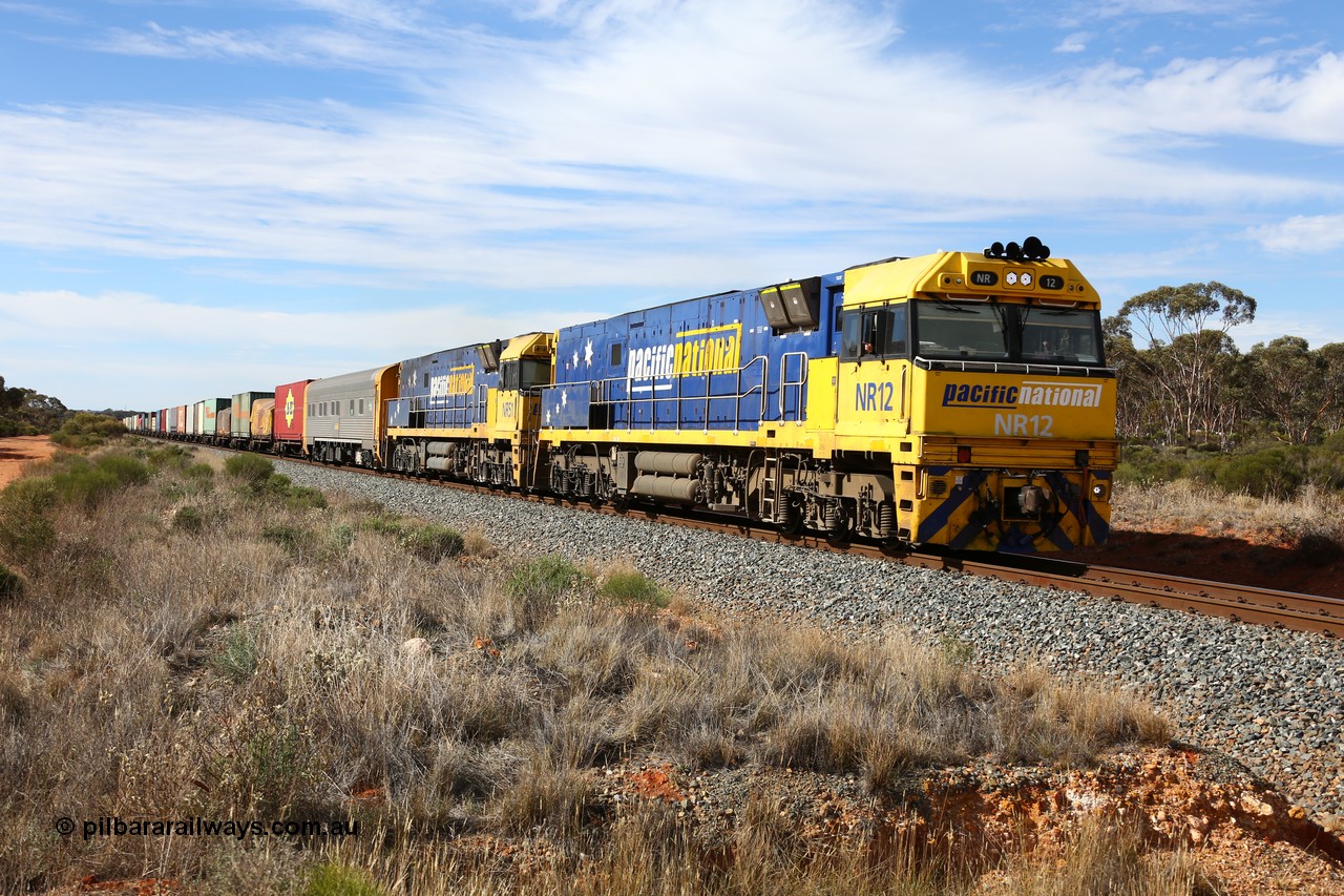 160523 3209
Binduli, Perth bound 7SP3 intermodal train, a pair of Goninan built GE model Cv40-9i NR class units NR 12 serial 7250-02/97-214 and NR 51 serial 7250-08/97-253 lead the train 'elephant style' near the 641 km.
Keywords: NR-class;NR12;Goninan;GE;Cv40-9i;7250-02/97-214;
