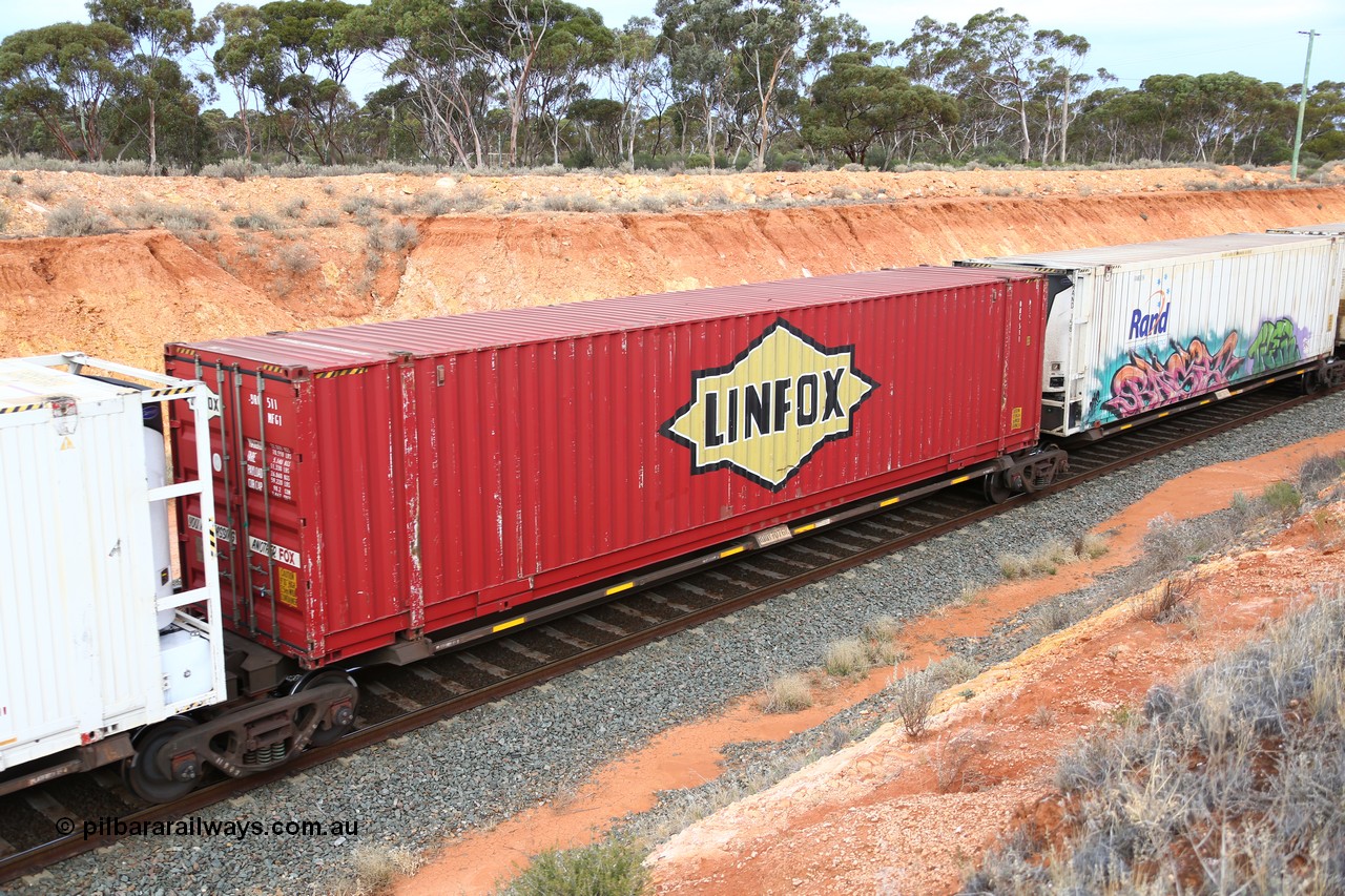 160524 3771
West Kalgoorlie, 2PM6 intermodal train, RQQY 7076 platform 3 of 5-pack articulated skel waggon set, 1 of 17 built by Qld Rail at Ipswich Workshops in 1995, 48' Linfox box DRC 511.
Keywords: RQQY-type;RQQY7076;Qld-Rail-Ipswich-WS;