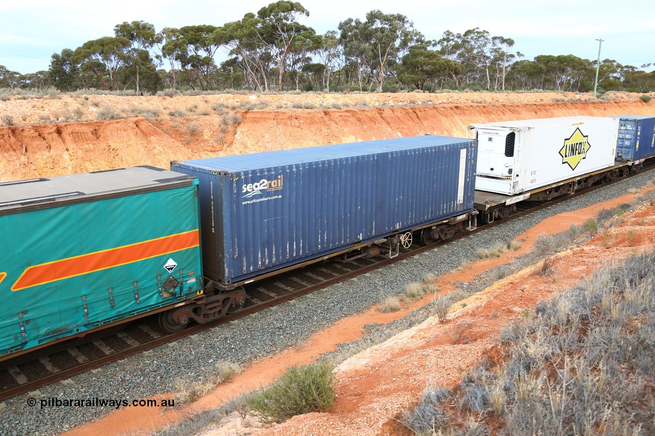 160524 3779
West Kalgoorlie, 2PM6 intermodal train, RQLY 4 platform 1 of 5-pack articulated skeletal waggon set, 1 of 8 built by AN Rail Islington Workshops in 1987 as AQJY, SCF sea2rail 40' 4EG1 type box SCFU 408239[6].
Keywords: RQJY-type;RQJY4;AN-Islington-WS;AQJY-type;