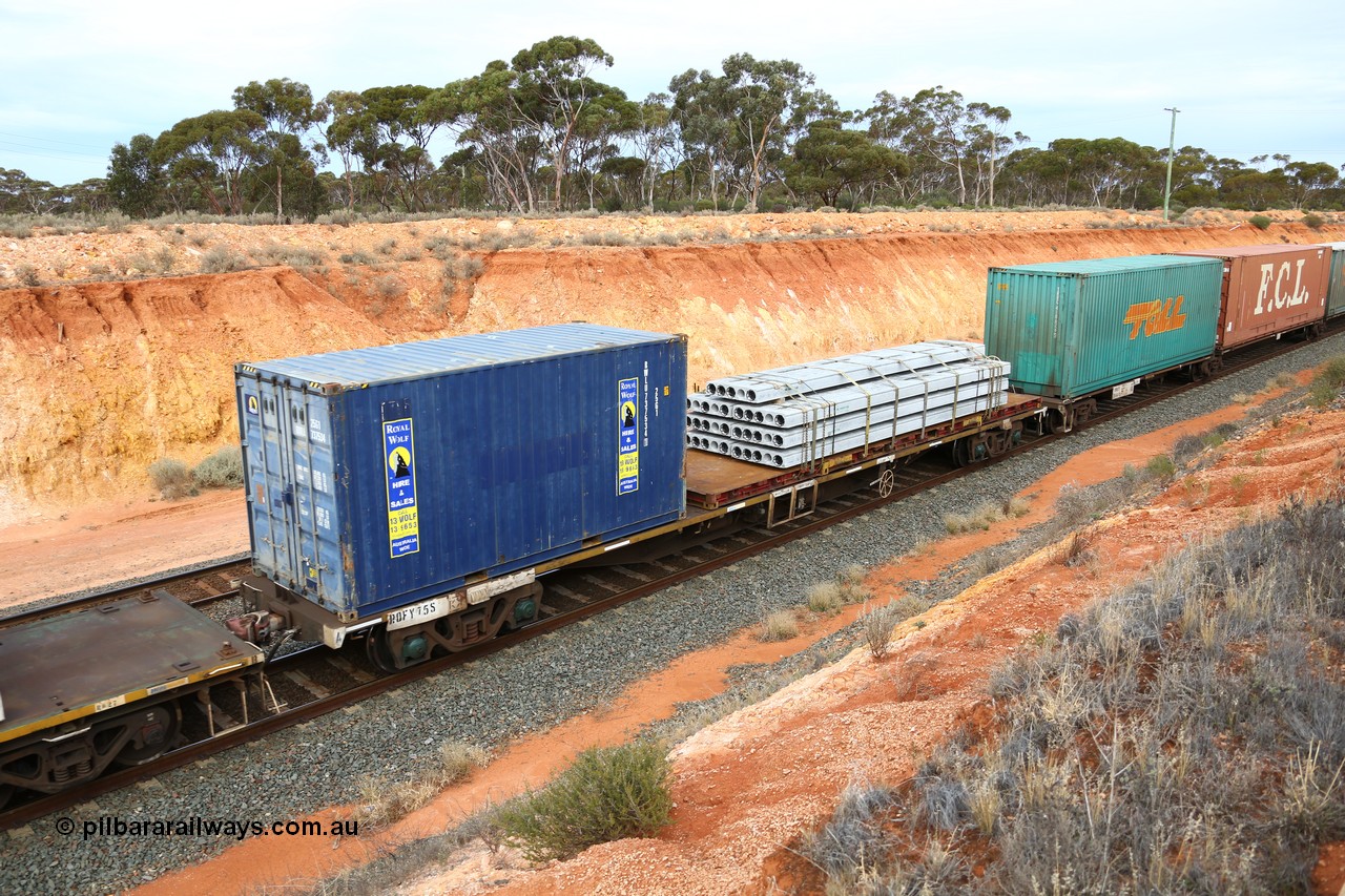160524 3781
West Kalgoorlie, 2PM6 intermodal train, RQFY 75 container waggon, built by Victorian Railways Bendigo Workshops in 1980 as a batch of seventy five VQFX type skeletal container waggons, recoded to VQFY c1985, then RQFY May 1994, May 1995 to RQFF, then 2CM bogies fitted in Aug 1995 and current code Nov 1995. Royal Wolf 20' 25G1 type box RWLU 737534[1] and a 40' flatrack KT 400725 with concrete panels.
Keywords: RQFY-type;RQFY75;Victorian-Railways-Bendigo-WS;VQFX-type;RQFF-type;