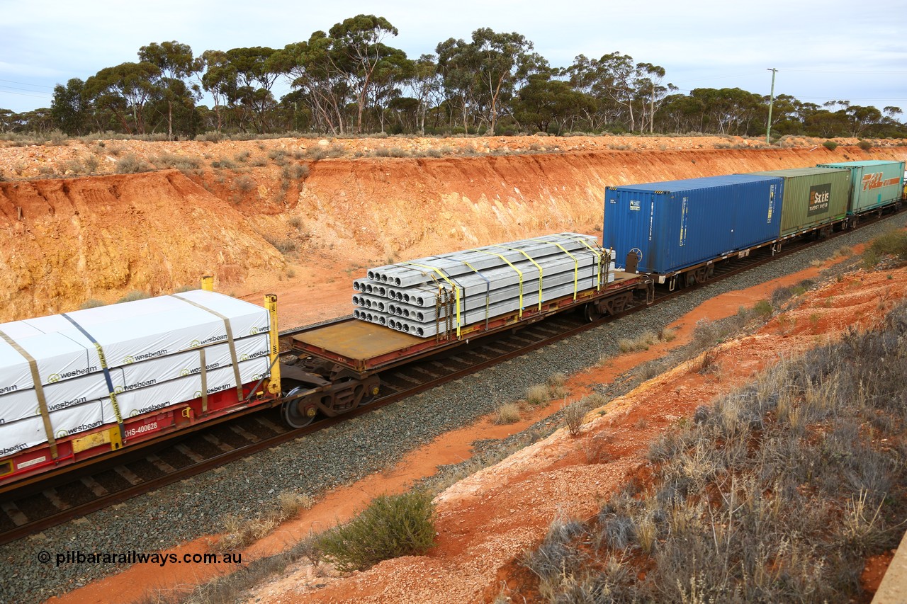 160524 3786
West Kalgoorlie, 2PM6 intermodal train, RRGY 7144 platform 5 of 5-pack articulated skeletal waggon set, one of fifty originally built by AN Rail Islington Workshops in 1996-97 as type RRBY, later rebuilt with 48' intermediate decks and recoded to RRGY, 40' flatrack KT 19.
Keywords: RRGY-type;RRGY7144;AN-Islington-WS;RRBY-type;
