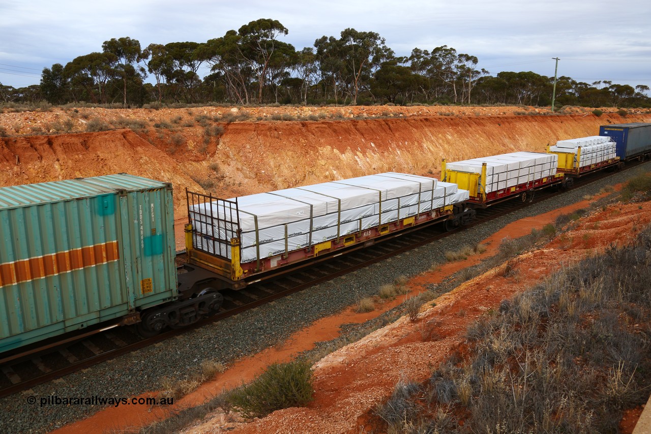 160524 3789
West Kalgoorlie, 2PM6 intermodal train, RRQY 8314 platform 2 of articulated five-unit container waggon set built by Qiqihar Rollingstock Works in China as part of a forty one unit order in 2005/06, K+S 40' flatrack KHS 400470 with Wesbeam products.
Keywords: RRQY-type;RRQY8314;Qiqihar-Rollingstock-Works-China;