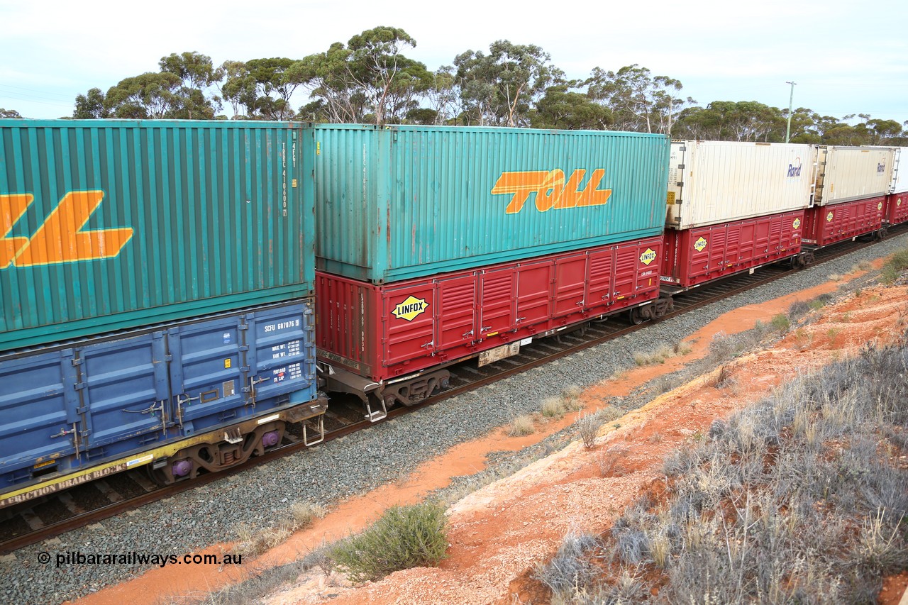 160524 3795
West Kalgoorlie, 2PM6 intermodal train, RRGY 7125 platform 1 of 5-pack articulated skeletal waggon set, one of fifty originally built by AN Rail Islington Workshops in 1996-97 as type RRBY, later rebuilt with 48' intermediate decks and recoded to RRGY, with a Linfox 40' half height side door LSDU 6940030 double stacked with Toll 40' 4FG1 type box TRRC 410629[1].
Keywords: RRGY-type;RRGY7125;AN-Islington-WS;RRBY-type;