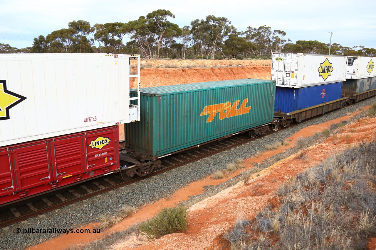 160524 3799
West Kalgoorlie, 2PM6 intermodal train, RRGY 7125 platform 3 of 5-pack articulated skeletal waggon set, one of fifty originally built by AN Rail Islington Workshops in 1996-97 as type RRBY, later rebuilt with 48' intermediate decks and recoded to RRGY, with a Toll 40' 4FG1 type box TRRC 410605[2].
Keywords: RRGY-type;RRGY7125;AN-Islington-WS;RRBY-type;