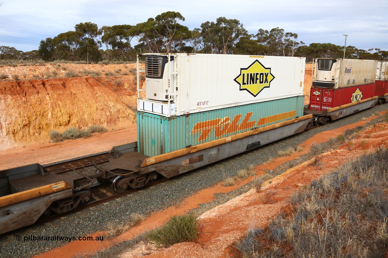 160524 3814
West Kalgoorlie, 2PM6 intermodal train, RQZY 7045 platform 3 of 5-pack well waggon set, one of thirty two sets built by Goninan NSW in 1995-96 for National Rail loaded with Toll 48' container MEG1 type TCML 48558 double stacked with Linfox 46' 6