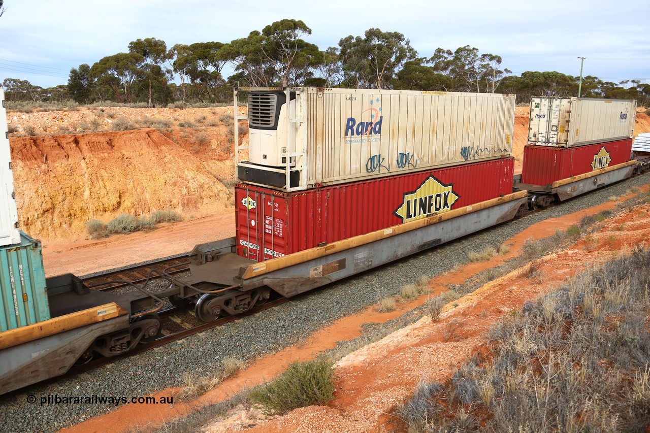 160524 3815
West Kalgoorlie, 2PM6 intermodal train, RQZY 7045 platform 2 of 5-pack well waggon set, one of thirty two sets built by Goninan NSW in 1995-96 for National Rail loaded with Linfox 48' MFG1 container DRC 529 double stacked with RAND Refrigerated Logistics 46' 6