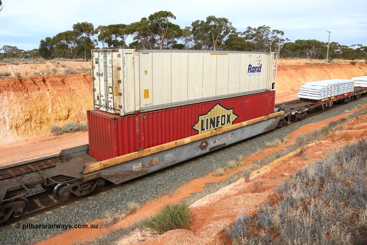 160524 3816
West Kalgoorlie, 2PM6 intermodal train, RQZY 7045 platform 1 of 5-pack well waggon set, one of thirty two sets built by Goninan NSW in 1995-96 for National Rail loaded with Linfox 48' MFG1 container DRC 455 double stacked with RAND Refrigerated Logistics 46' 6