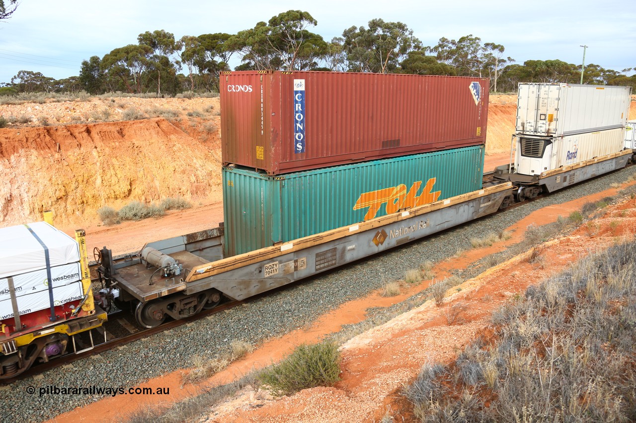 160524 3819
West Kalgoorlie, 2PM6 intermodal train, RQZY 7041 platform 5 of 5-pack well waggon set, one of thirty two sets built by Goninan NSW in 1995-96 for National Rail loaded with a Toll 40' 4FG1 type container TRRC 410624[4] double stacked with Cronos 40' 4EG1 type container CRXU 093445[9].
Keywords: RQZY-type;RQZY7041;Goninan-NSW;