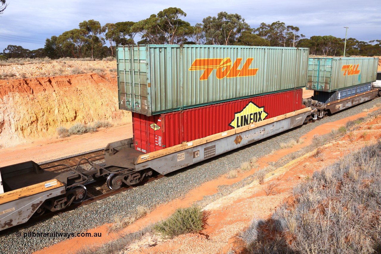 160524 3823
West Kalgoorlie, 2PM6 intermodal train, RQZY 7041 platform 1 of 5-pack well waggon set, one of thirty two sets built by Goninan NSW in 1995-96 for National Rail loaded with a Linfox 48' container DRC 917 double stacked with a Toll 53' car container AB 032.
Keywords: RQZY-type;RQZY7041;Goninan-NSW;