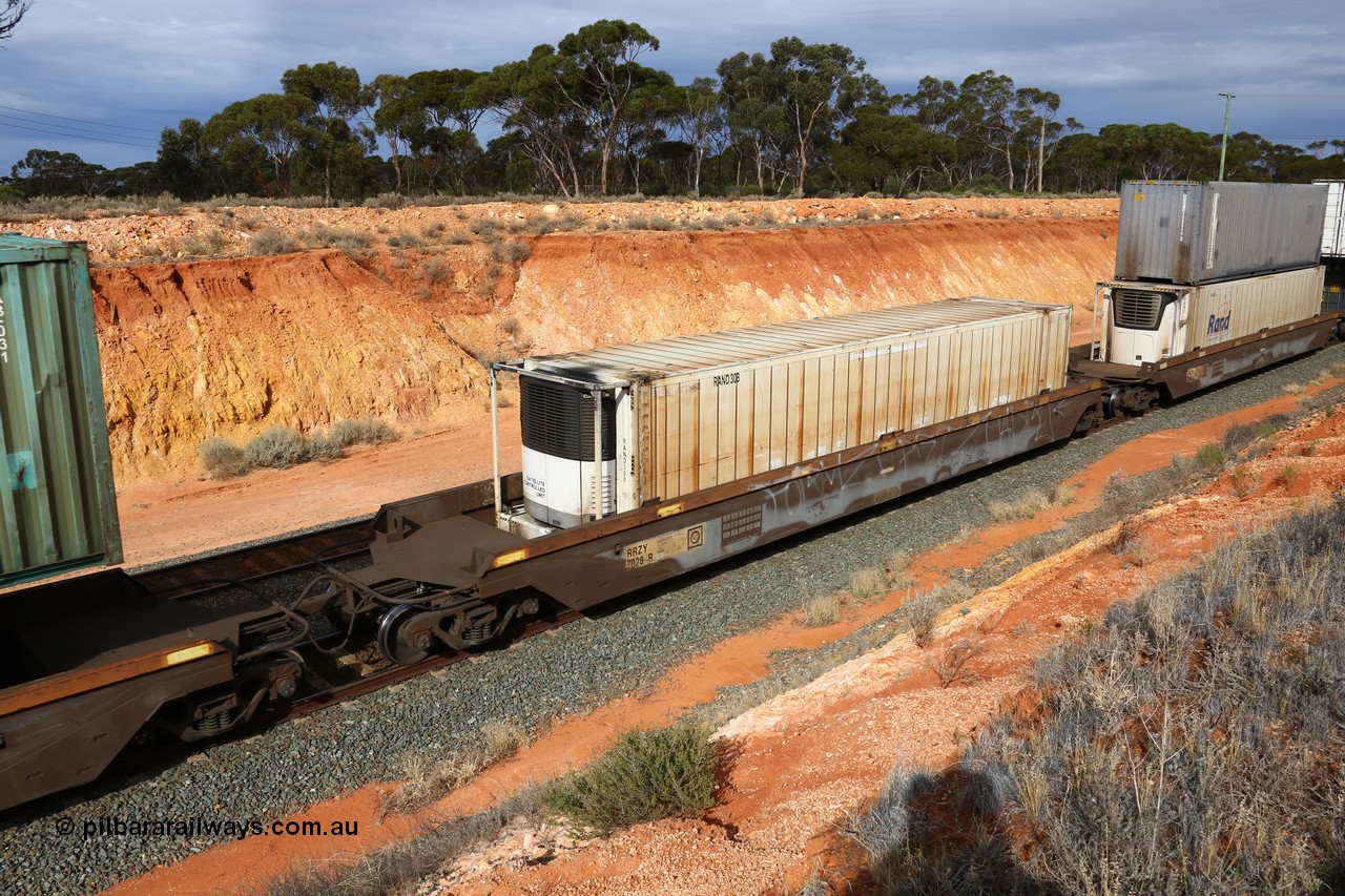 160524 3825
West Kalgoorlie, 2PM6 intermodal train, RRZY type five unit bar coupled well container waggon set RRZY 7028 platform 2, originally built by Goninan in a batch of twenty six as RQZY type for National Rail, recoded when repaired. Loaded with a plain RAND 46' 6