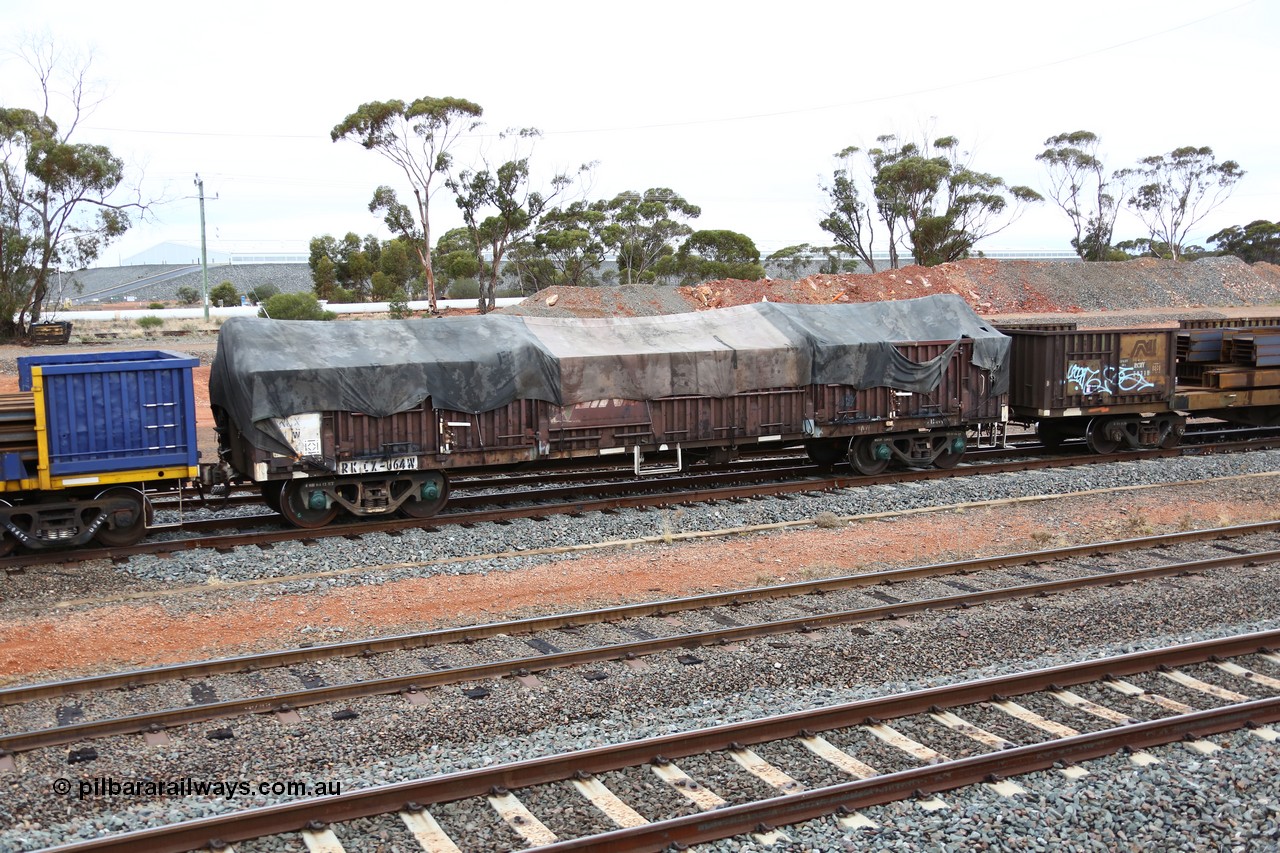 160524 4312
West Kalgoorlie, 1MP2 steel train, RKCX type open waggon RKCX 64, originally built by Victorian Railways Newport Workshops as ELF type open waggon in 1963, later recoded to ELX. Recoded to VOCX in 1978, VOFX in 1978, 1994 to ROBX then 1995 for current code. V/LINE name still visible under Pacific National tarp.
Keywords: RKCX-type;RKCX64;Victorian-Railways-Newport-WS;ELX-type;VOCX-type;VOFX-type;ROBX-type;