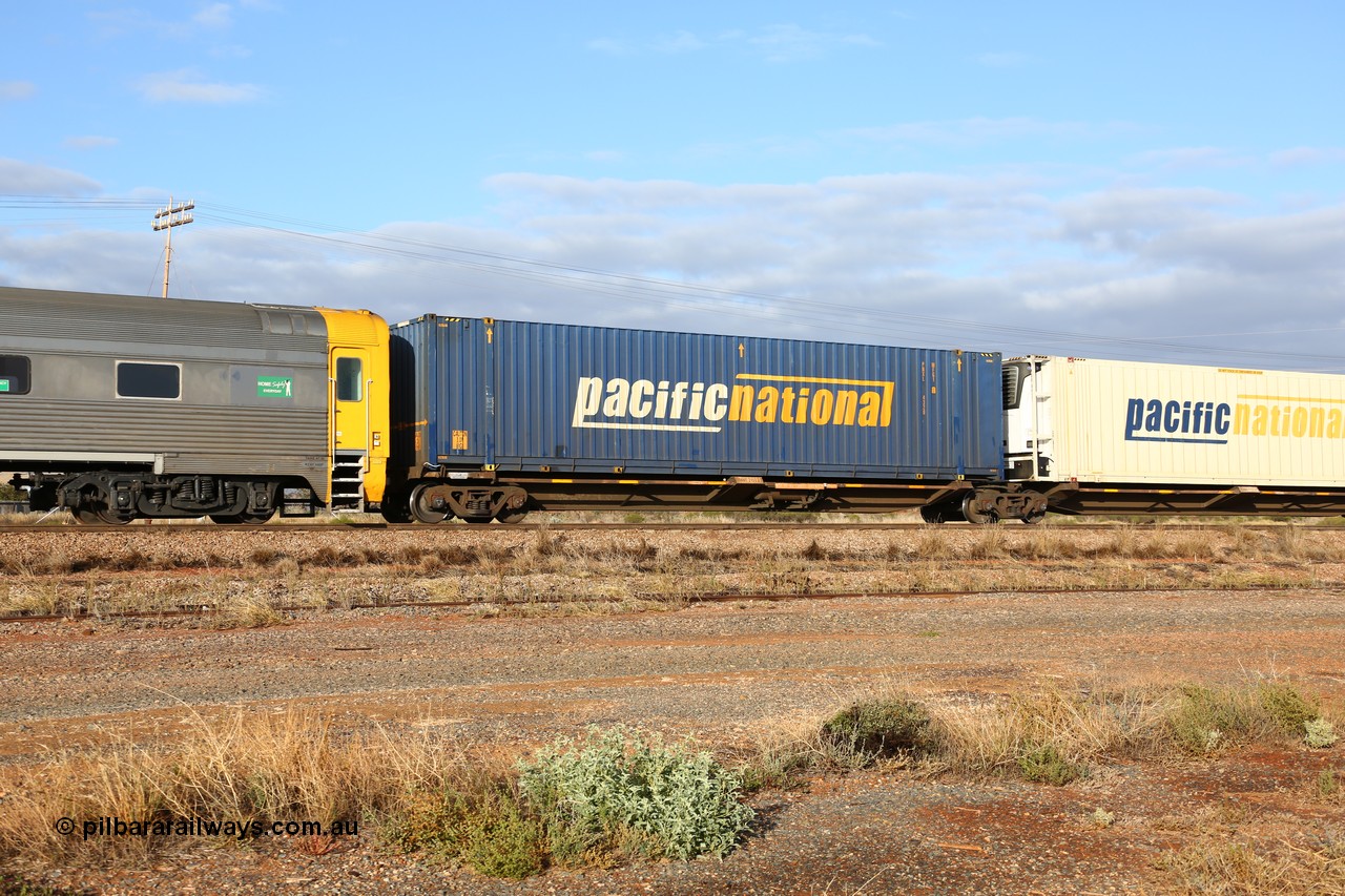 160525 4441
Parkeston, 3PM7 priority service train, RQQY 7077 platform 1 of 5-pack articulated skel waggon set, 1 of 17 built by Qld Rail at Ipswich Workshops in 1995, 48' Pacific National box PNXL 4320.
Keywords: RQQY-type;RQQY7077;Qld-Rail-Ipswich-WS;