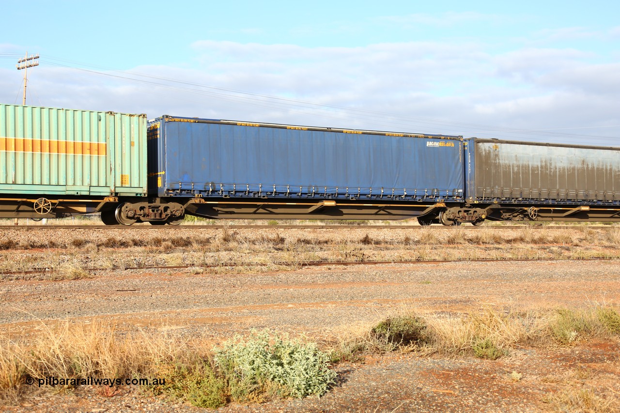 160525 4454
Parkeston, 3PM7 priority service train, RRQY 8408 platform 2 of 5-pack articulated skel waggon, one of thirty four sets built by Qiqihar Rollingstock Works China in 2012, 48' deck with a Pacific National 48' curtainsider PNXC 5631.
Keywords: RRQY-type;RRQY8408;Qiqihar-Rollingstock-Works-China;