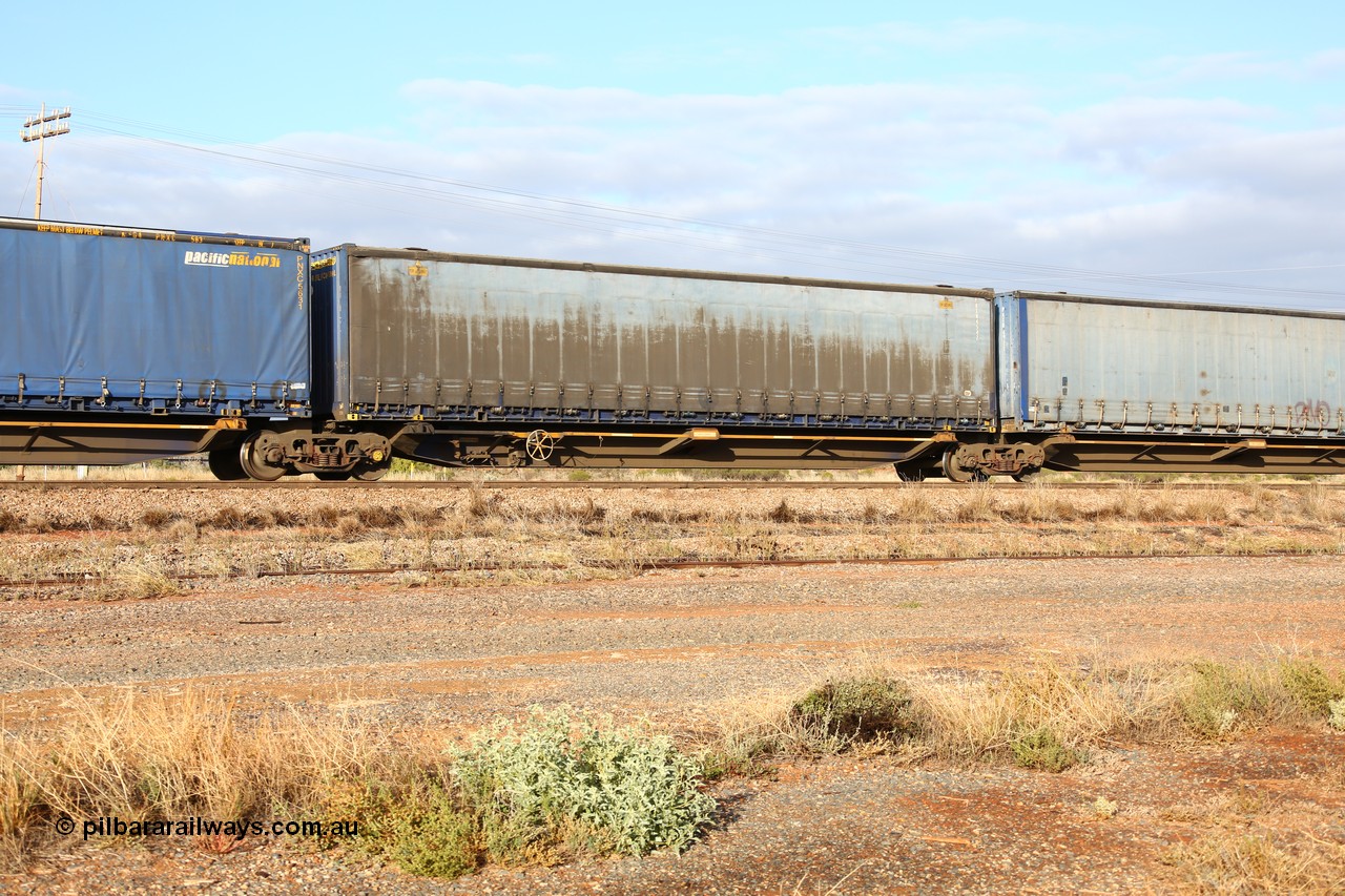 160525 4455
Parkeston, 3PM7 priority service train, RRQY 8408 platform 3 of 5-pack articulated skel waggon, one of thirty four sets built by Qiqihar Rollingstock Works China in 2012, 48' deck with a Pacific National 48' curtainsider PNXM 4542.
Keywords: RRQY-type;RRQY8408;Qiqihar-Rollingstock-Works-China;