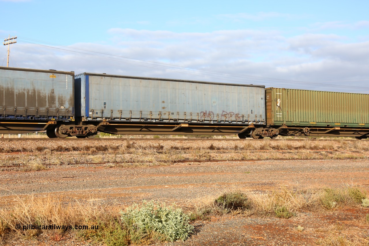160525 4456
Parkeston, 3PM7 priority service train, RRQY 8408 platform 4 of 5-pack articulated skel waggon, one of thirty four sets built by Qiqihar Rollingstock Works China in 2012, 48' deck with a Pacific National 48' curtainsider PNXM 4522.
Keywords: RRQY-type;RRQY8408;Qiqihar-Rollingstock-Works-China;