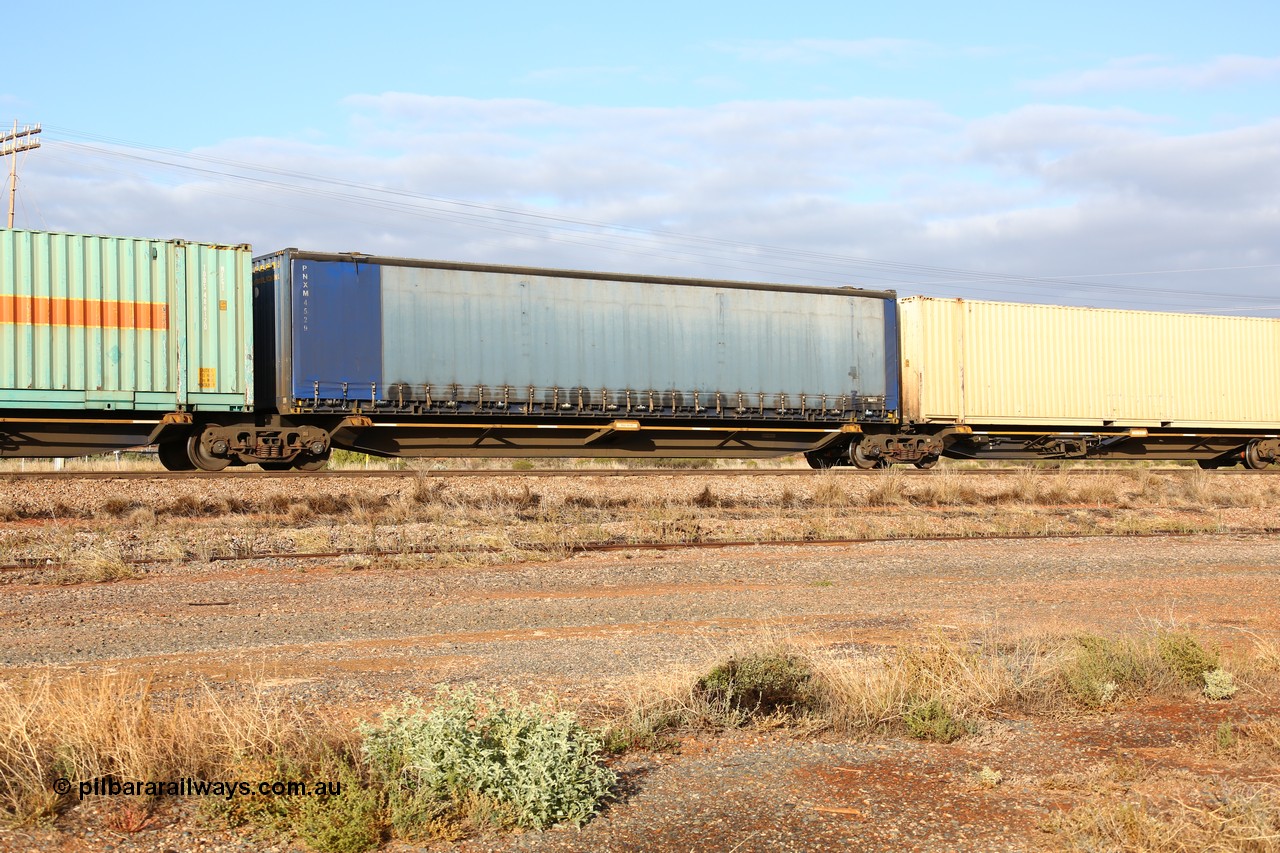 160525 4474
Parkeston, 3PM7 priority service train, RRQY 8516 platform 2 of 5-pack articulated skel waggon, one of thirty four sets built by Qiqihar Rollingstock Works China in 2012, 48' deck with a Pacific National 48' curtainsider PNXM 4529.
Keywords: RRQY-type;RRQY8516;Qiqihar-Rollingstock-Works-China;