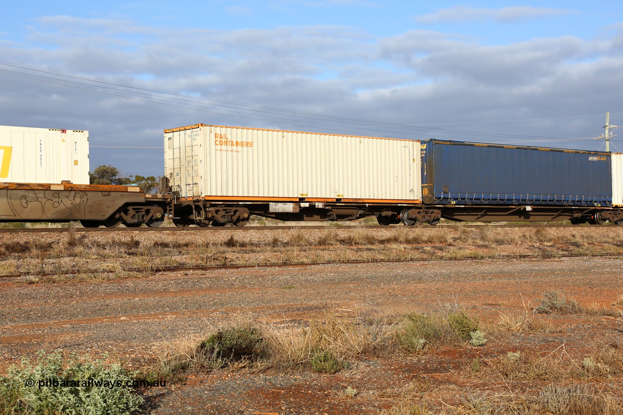 160525 4481
Parkeston, 3PM7 priority service train, RRAY 7249 platform 5 of 5-pack articulated skel waggon set, one of 100 built by ABB Engineering NSW 1996-2000, 40' deck with a 40' Rail Containers sea2rail box SCFU 412081.
Keywords: RRAY-type;RRAY7249;ABB-Engineering-NSW;