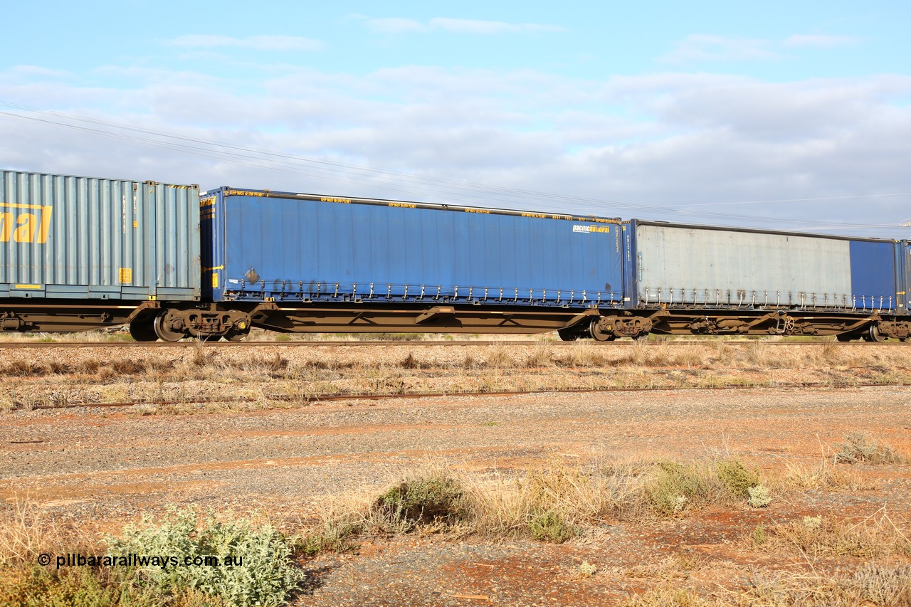 160525 4515
Parkeston, 3PM7 priority service train, RRQY 7327 platform 2 of 5-pack articulated skel waggon set built by Qiqihar Rollingstock Works China in 2005 for Pacific National, with a 48' Pacific National curtainsider PNXC 5632.
Keywords: RRQY-type;RRQY7327;Qiqihar-Rollingstock-Works-China;