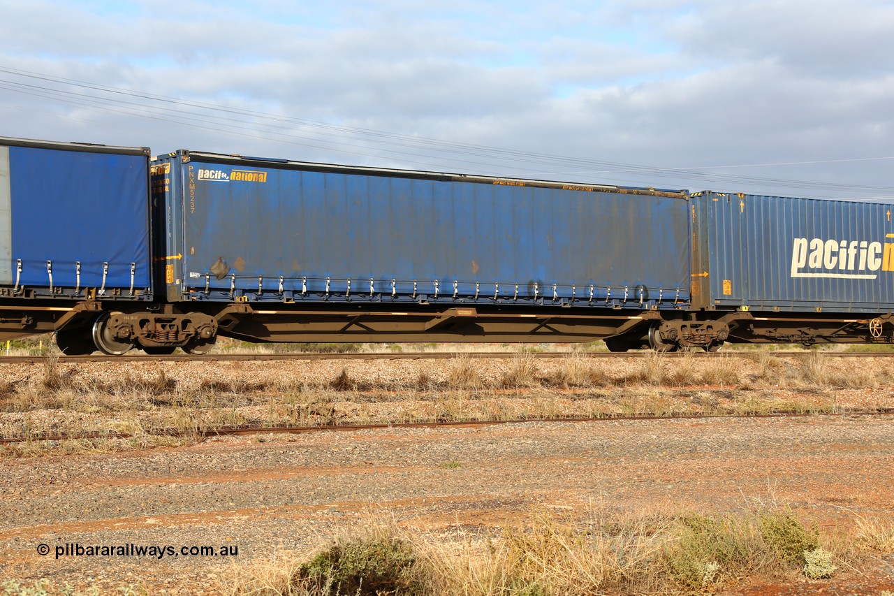 160525 4517
Parkeston, 3PM7 priority service train, RRQY 7327 platform 4 of 5-pack articulated skel waggon set built by Qiqihar Rollingstock Works China in 2005 for Pacific National, with a 48' Pacific National curtainsider PNXM 5237.
Keywords: RRQY-type;RRQY7327;Qiqihar-Rollingstock-Works-China;