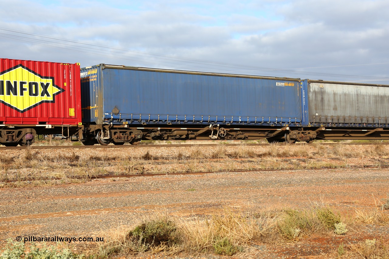 160525 4526
Parkeston, 3PM7 priority service train, RRQY 8344 platform 5 of 5-pack articulated skel waggon set the last of a batch of 41 built by Qiqihar Rollingstock Works China in 2005 for Pacific National, with a Pacific National 48' curtainsider PNXM 5225.
Keywords: RRQY-type;RRQY8344;Qiqihar-Rollingstock-Works-China;