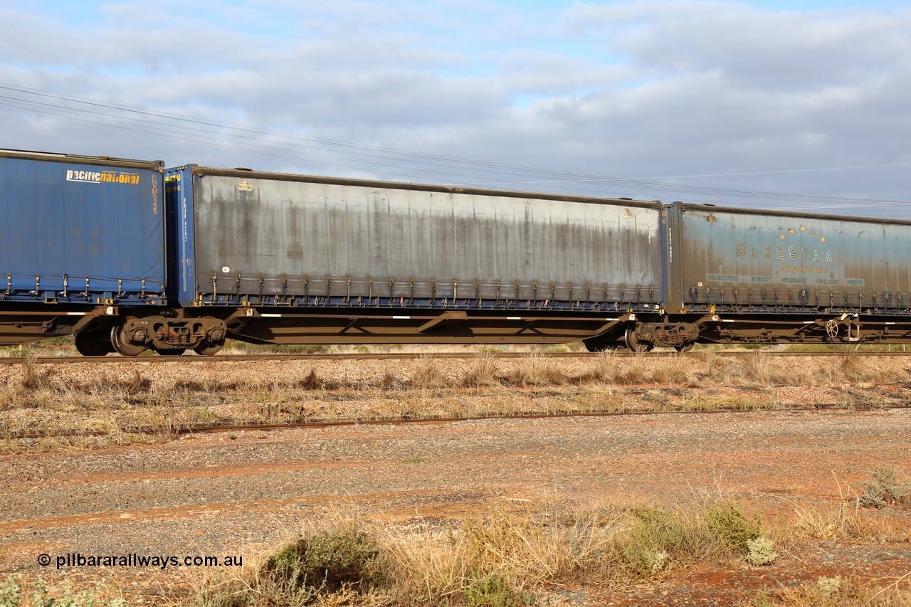 160525 4527
Parkeston, 3PM7 priority service train, RRQY 8344 platform 4 of 5-pack articulated skel waggon set the last of a batch of 41 built by Qiqihar Rollingstock Works China in 2005 for Pacific National, with a Pacific National 48' curtainsider PNXM 4543.
Keywords: RRQY-type;RRQY8344;Qiqihar-Rollingstock-Works-China;