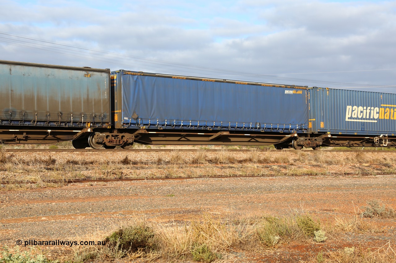 160525 4529
Parkeston, 3PM7 priority service train, RRQY 8344 platform 2 of 5-pack articulated skel waggon set the last of a batch of 41 built by Qiqihar Rollingstock Works China in 2005 for Pacific National, with a Pacific National 48' curtainsider PNXM 5203.
Keywords: RRQY-type;RRQY8344;Qiqihar-Rollingstock-Works-China;