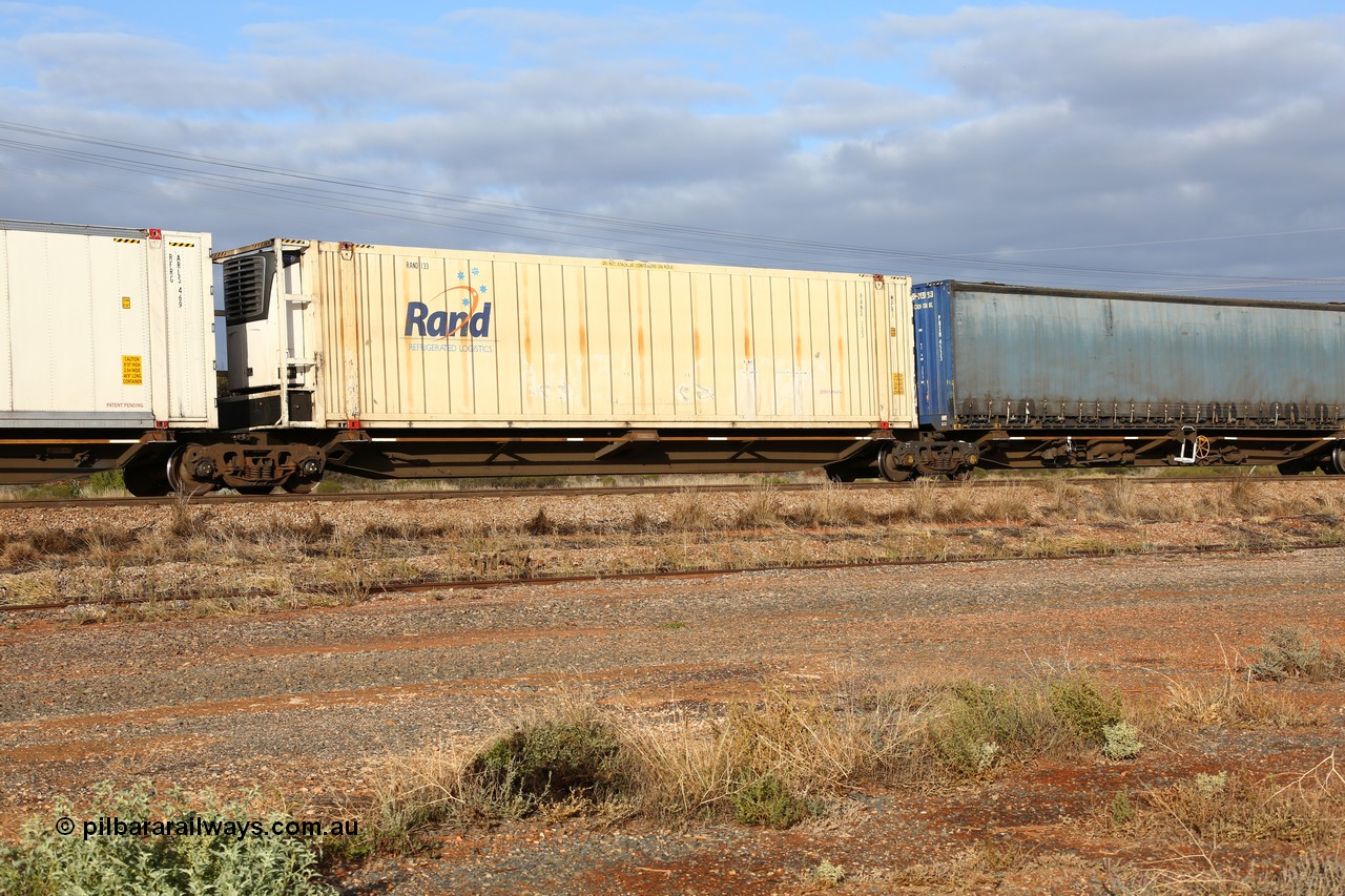 160525 4541
Parkeston, 3PM7 priority service train, RRQY 7330 platform 2 of 5-pack articulated skel waggon, one of sixteen sets built by Qiqihar Rollingstock Works China in 2005, 48' deck with a RAND Refrigerated Logistics 46' 6