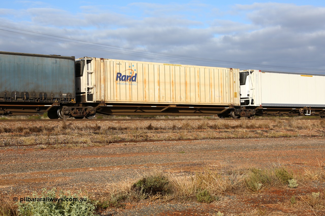 160525 4543
Parkeston, 3PM7 priority service train, RRQY 7330 platform 4 of 5-pack articulated skel waggon, one of sixteen sets built by Qiqihar Rollingstock Works China in 2005, 48' deck with a RAND Refrigerated Logistics 46' 6