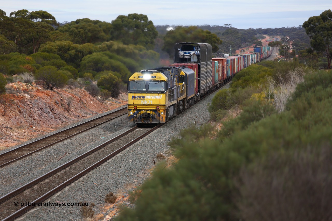 160526 5197
West Kalgoorlie, Melbourne bound intermodal train 4PM6 arrives with Binduli in the distance behind Goninan built GE model Cv40-9i NR class units NR 71 serial 7250-01/97-273 and NR 12 serial 7250-02/97-214.
Keywords: NR-class;NR71;Goninan;GE;Cv40-9i;7250-01/97-273;