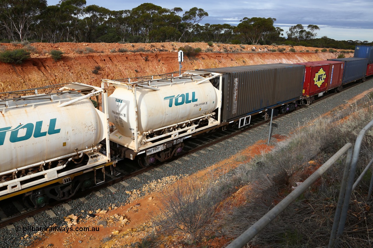 160526 5222
West Kalgoorlie, 4PM6 intermodal train, RQFY 63 container waggon, built by Victorian Railways Bendigo Workshops in 1980 as a batch of seventy five VQFX type skeletal container waggons, recoded to VQFY, then RQFF, then 2CM bogies fitted in 1995, 20' Jamieson built tanktainer Toll JTSU 011395 and plain blue SCF Austrans 40' box.
Keywords: RQFY-type;RQFY63;Victorian-Railways-Bendigo-WS;VQFX-type;RQFF-type;